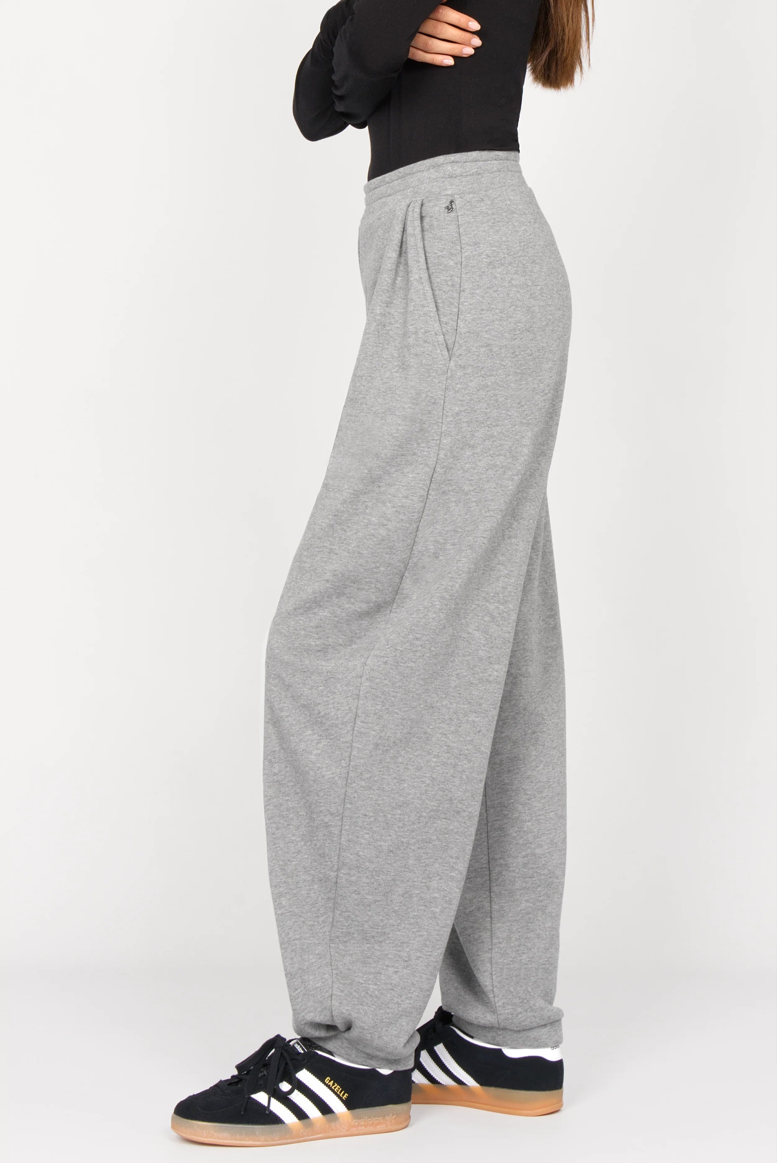 Side view of ELVEA O-Shape Sweathose in grey relaxed fit with elastic waistband and tapered legs