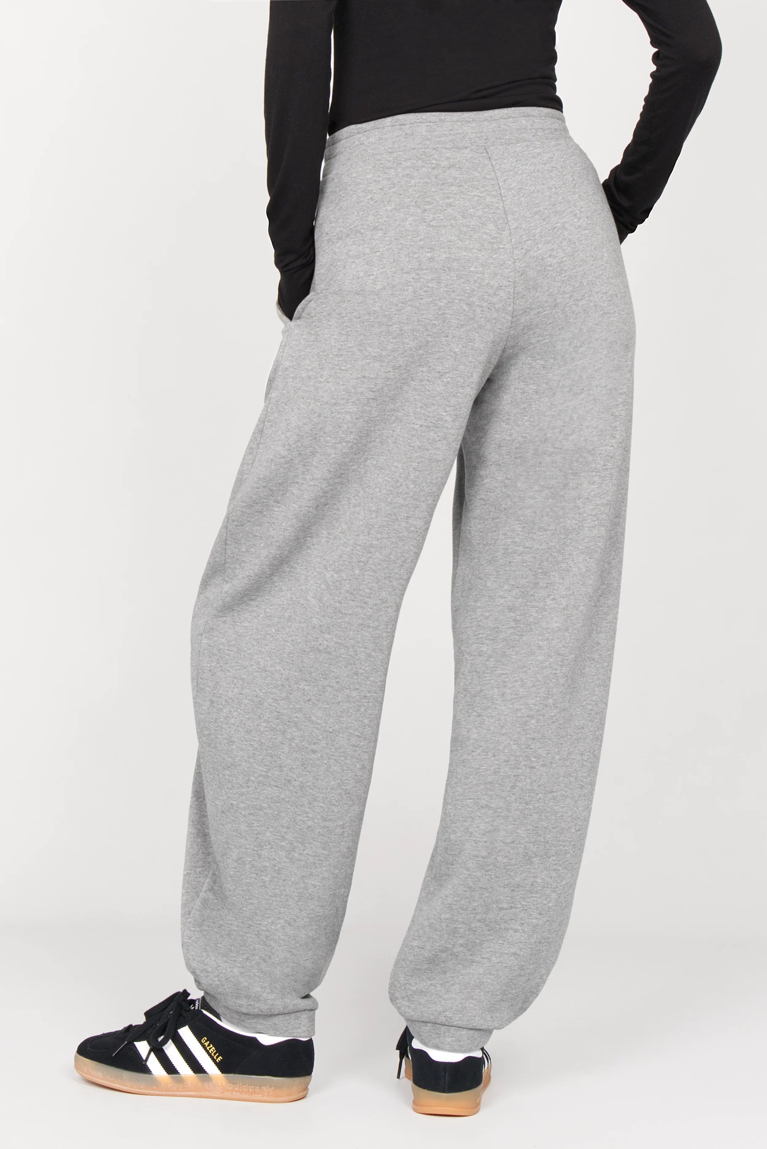 Back view of ELVEA O-Shape Sweathose in grey relaxed fit with elastic waistband and cuffed ankles.