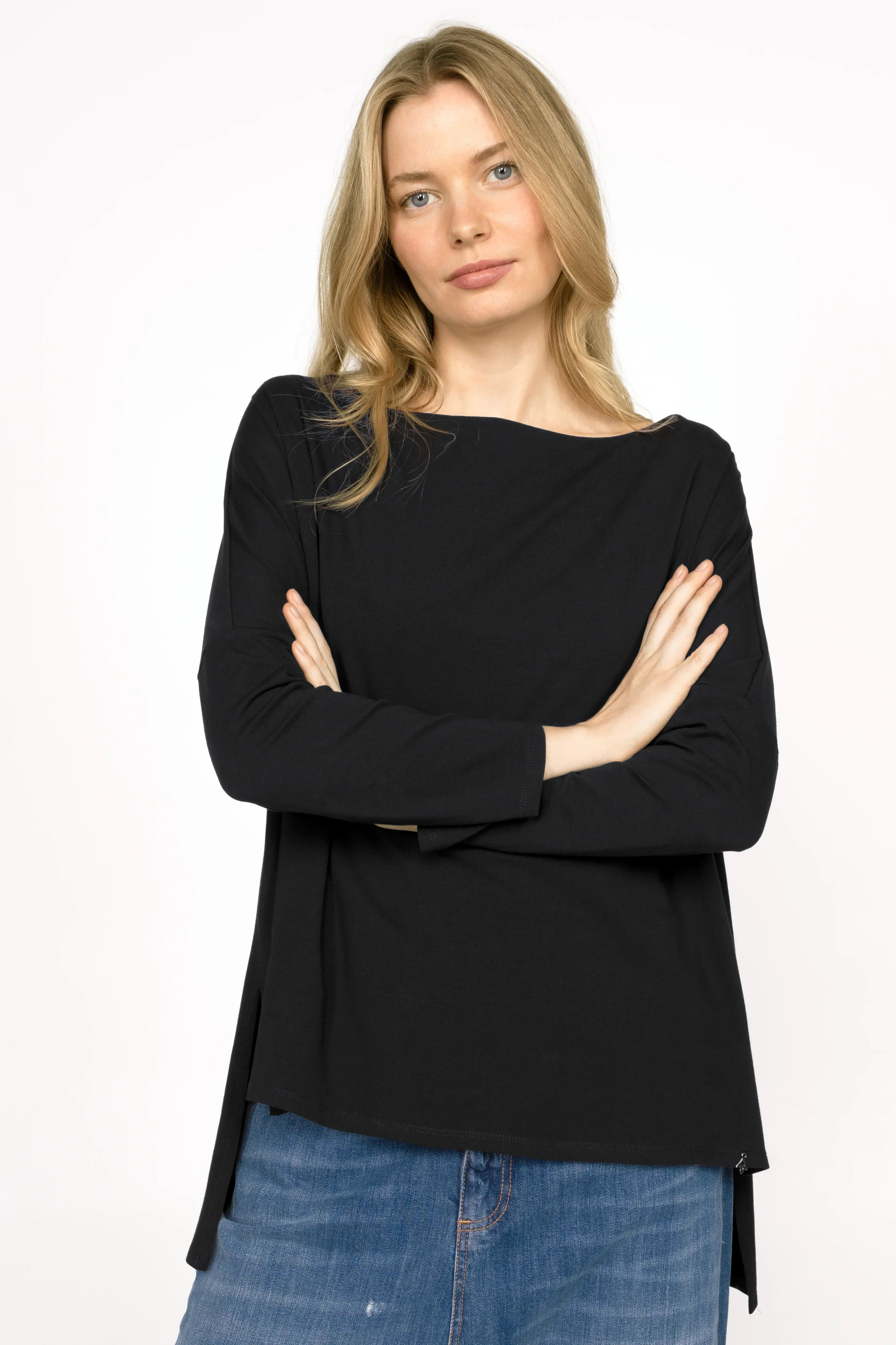 Woman wearing black AMALEA Relaxed Fit longsleeve with boat neckline and side slits