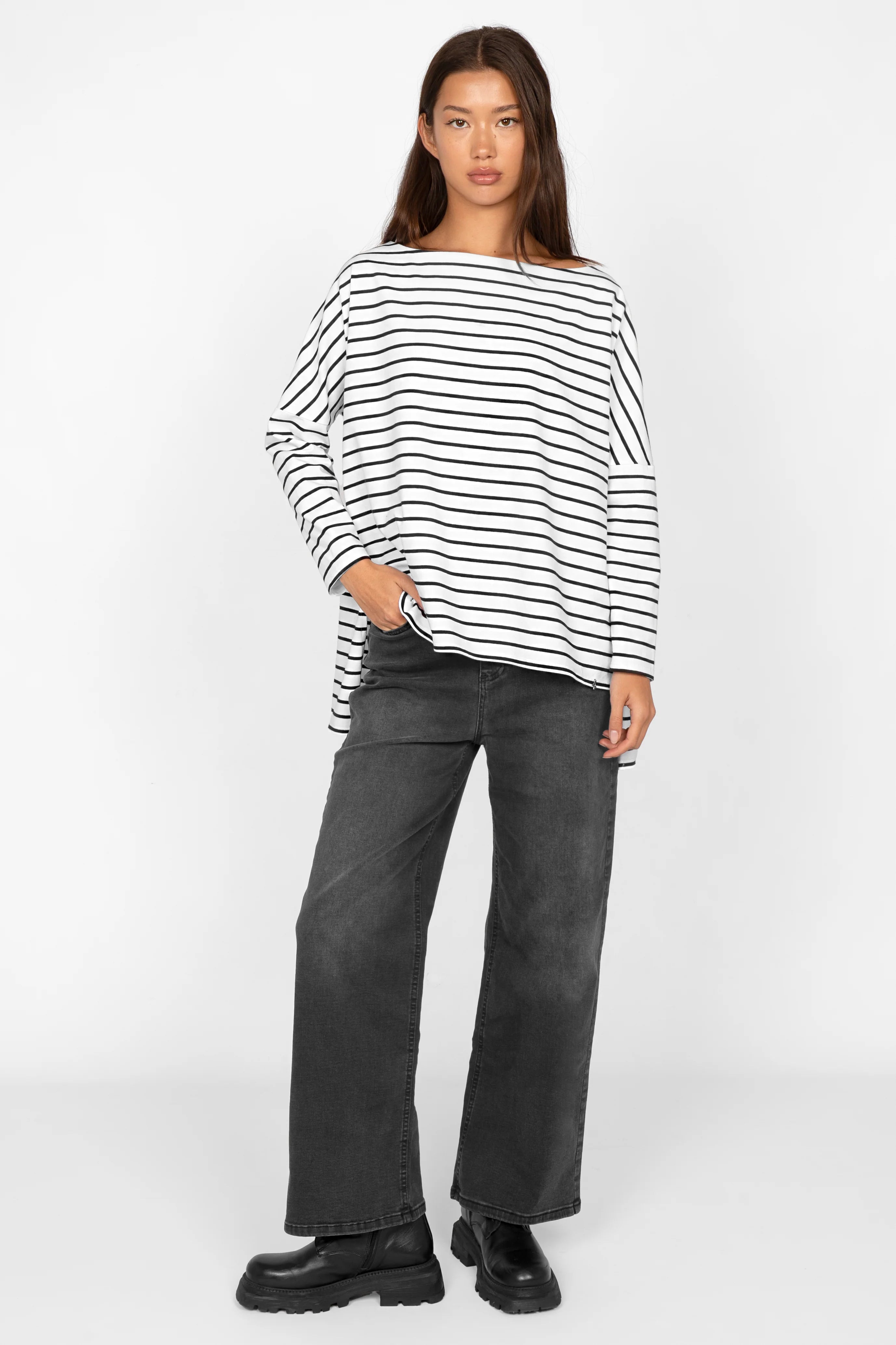 Woman wearing AMALEA Gestreiftes Longsleeve black and white striped cotton stretch top with relaxed fit, boat neckline, and longer back hem.