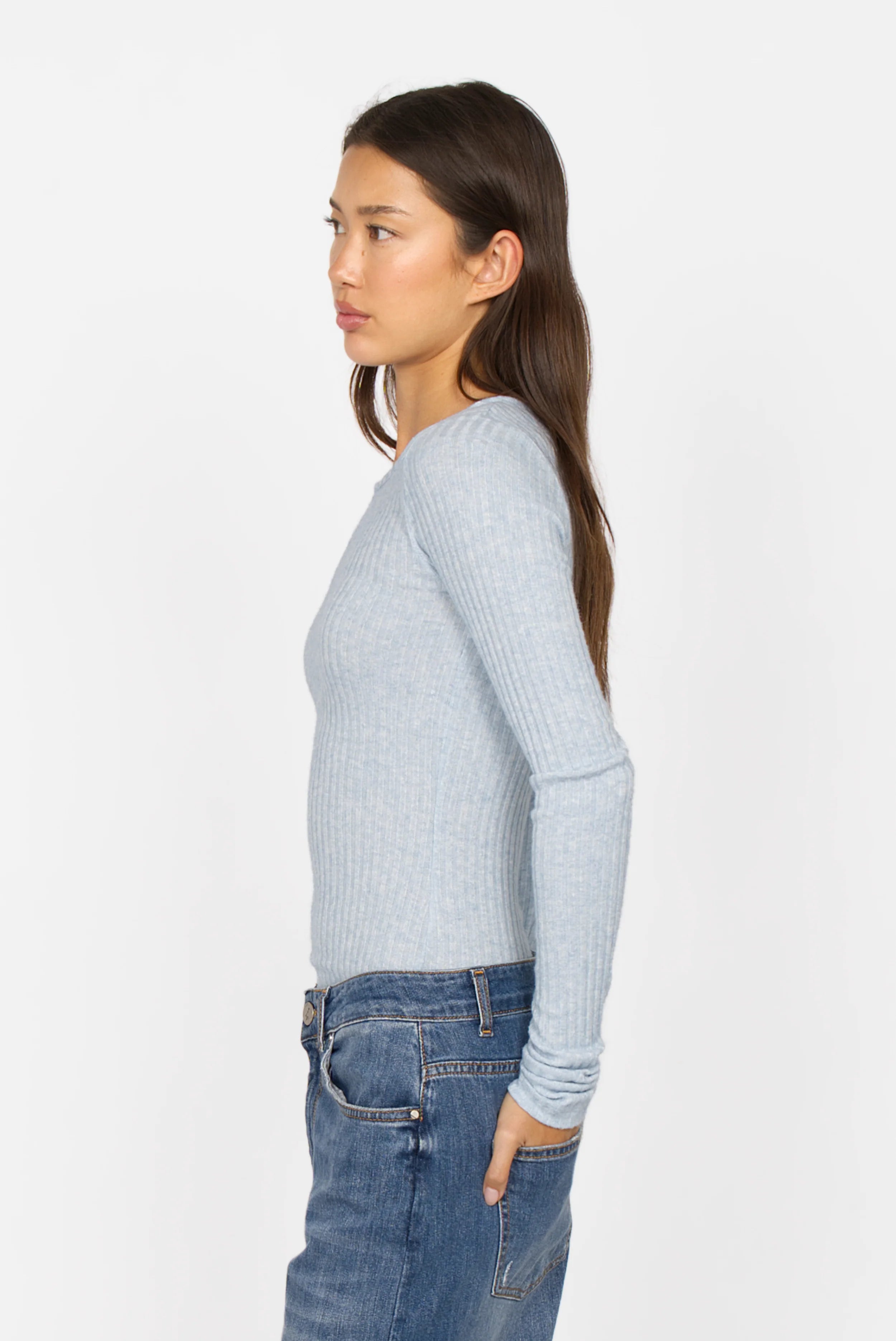 Slim fit BETTIE Longsleeve in light blue with ribbed texture and extra long sleeves worn by female model