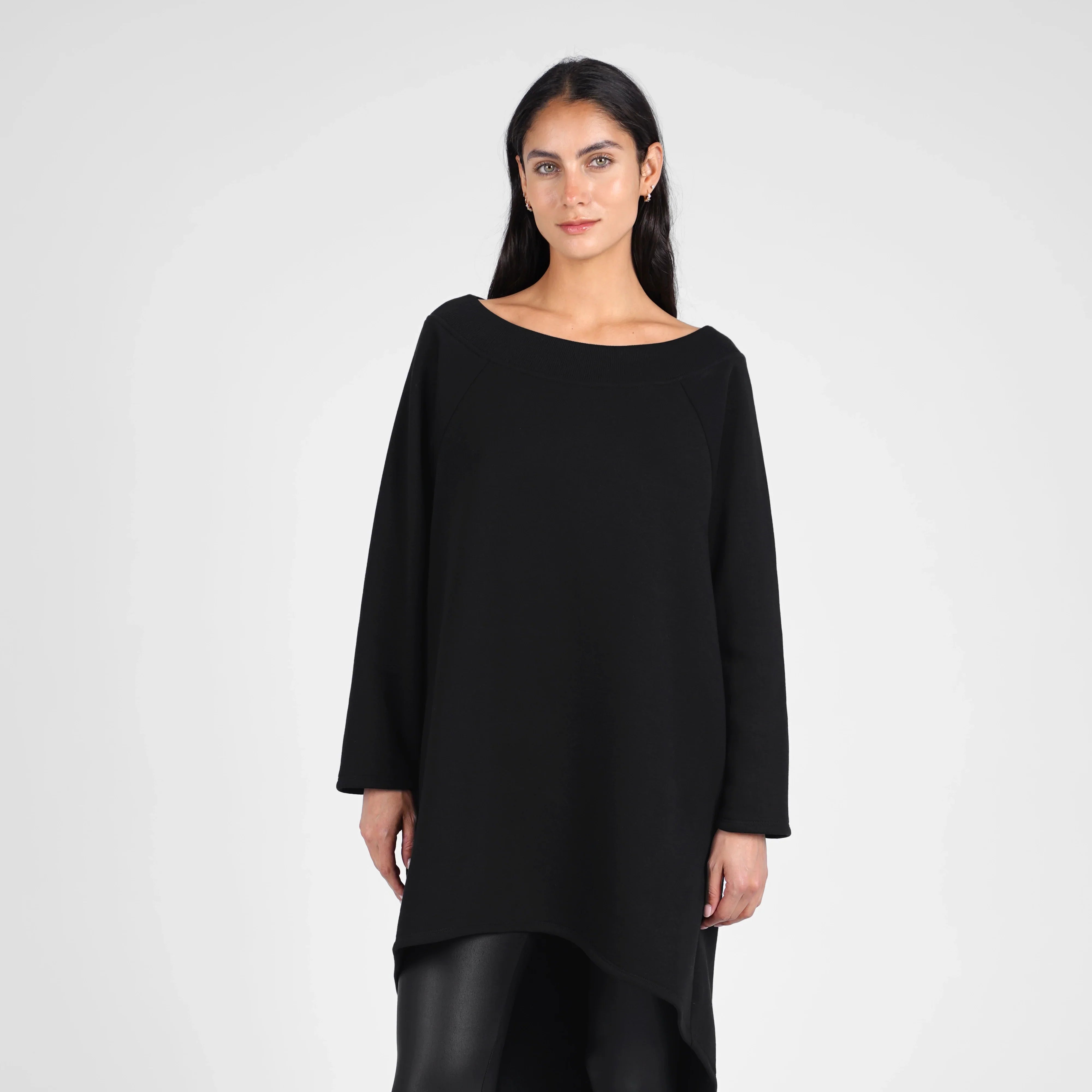 Woman wearing black CHERIN Super-Longsweater with U-boat neckline and asymmetrical hem