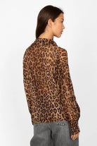 Back view of woman wearing EDITHA Seidenbluse lightweight leopard print silk blend blouse with relaxed fit and tie collar