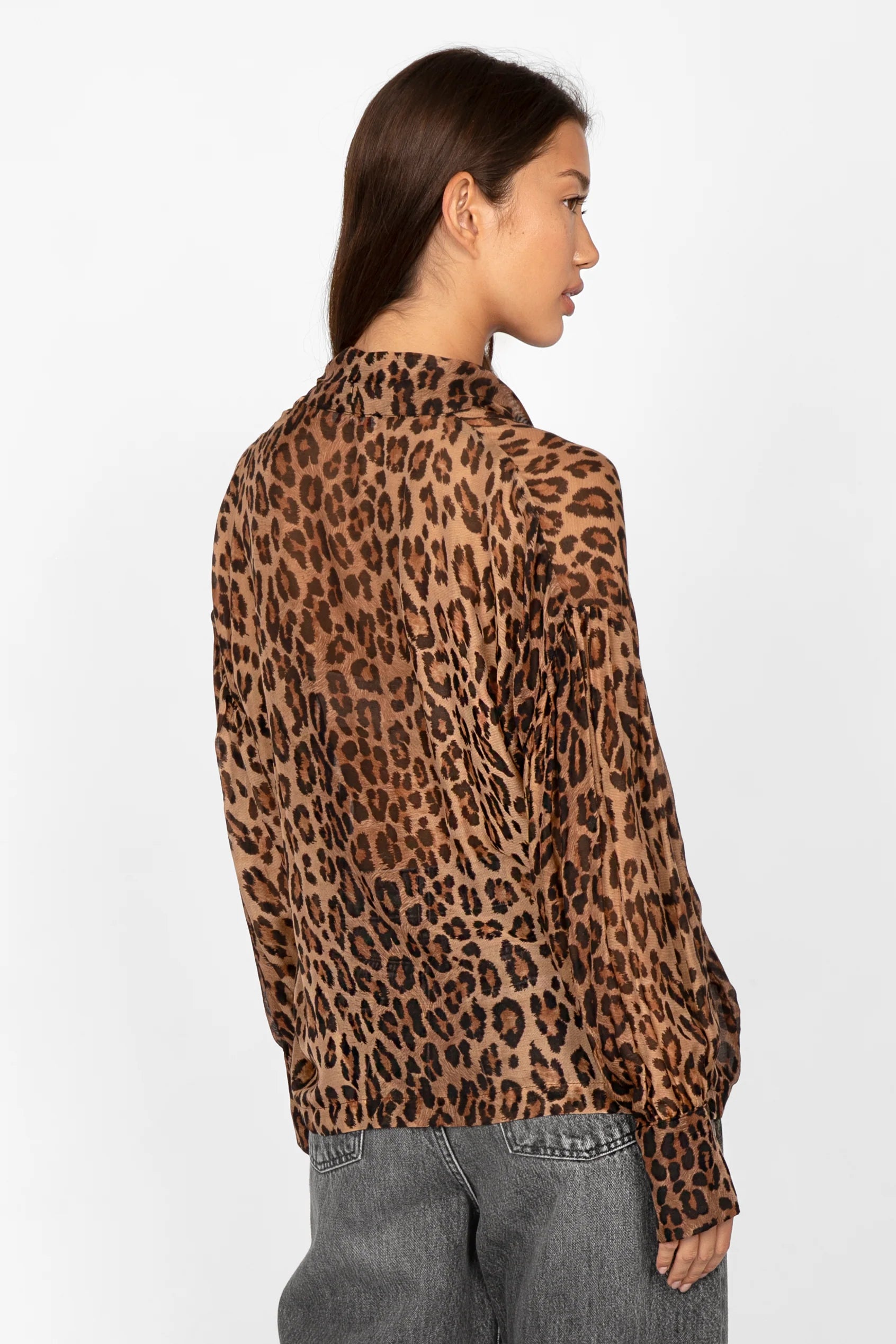 Back view of woman wearing EDITHA Seidenbluse lightweight leopard print silk blend blouse with relaxed fit and tie collar