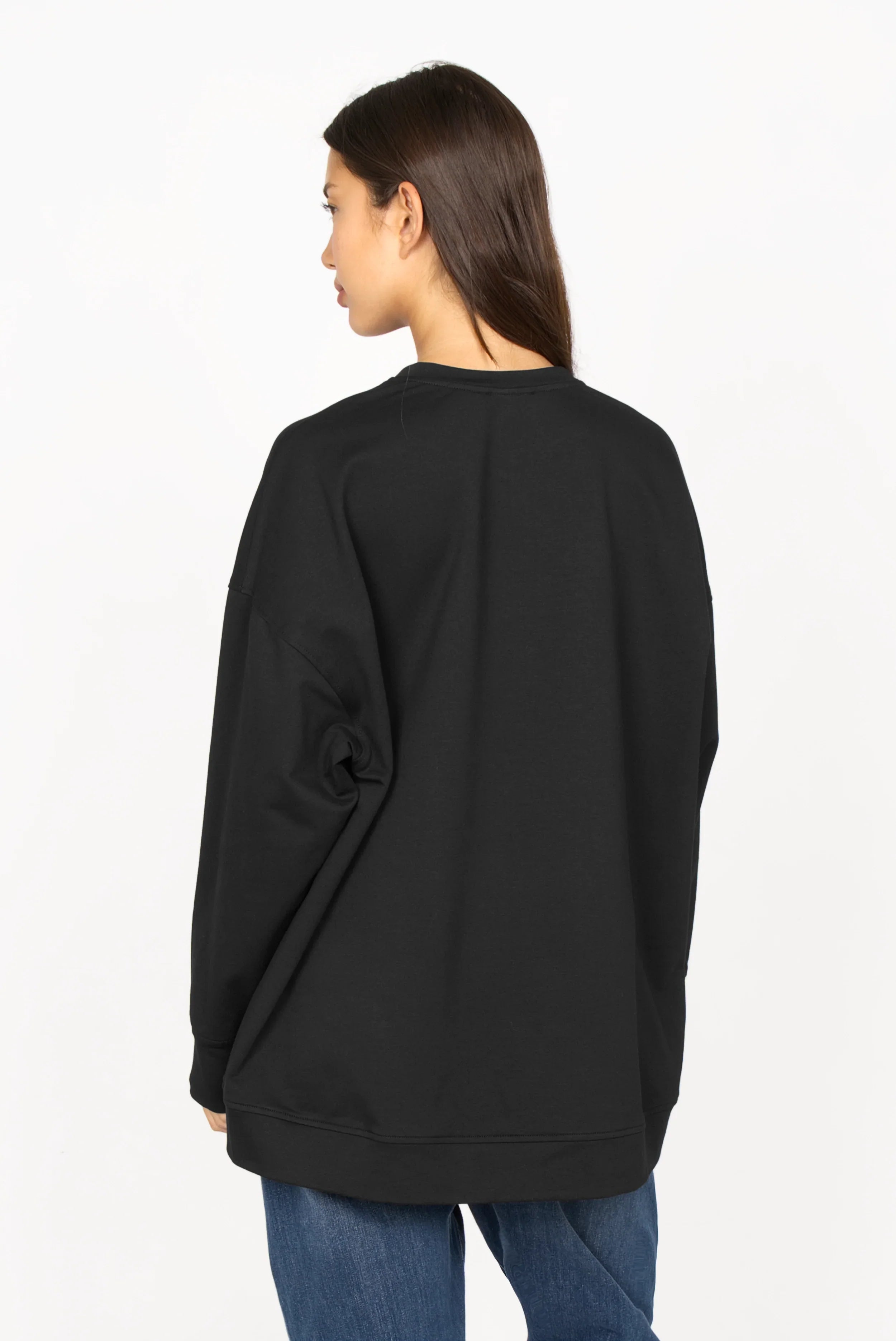 Black EIREL oversize sweater with relaxed fit and dropped shoulders on model
