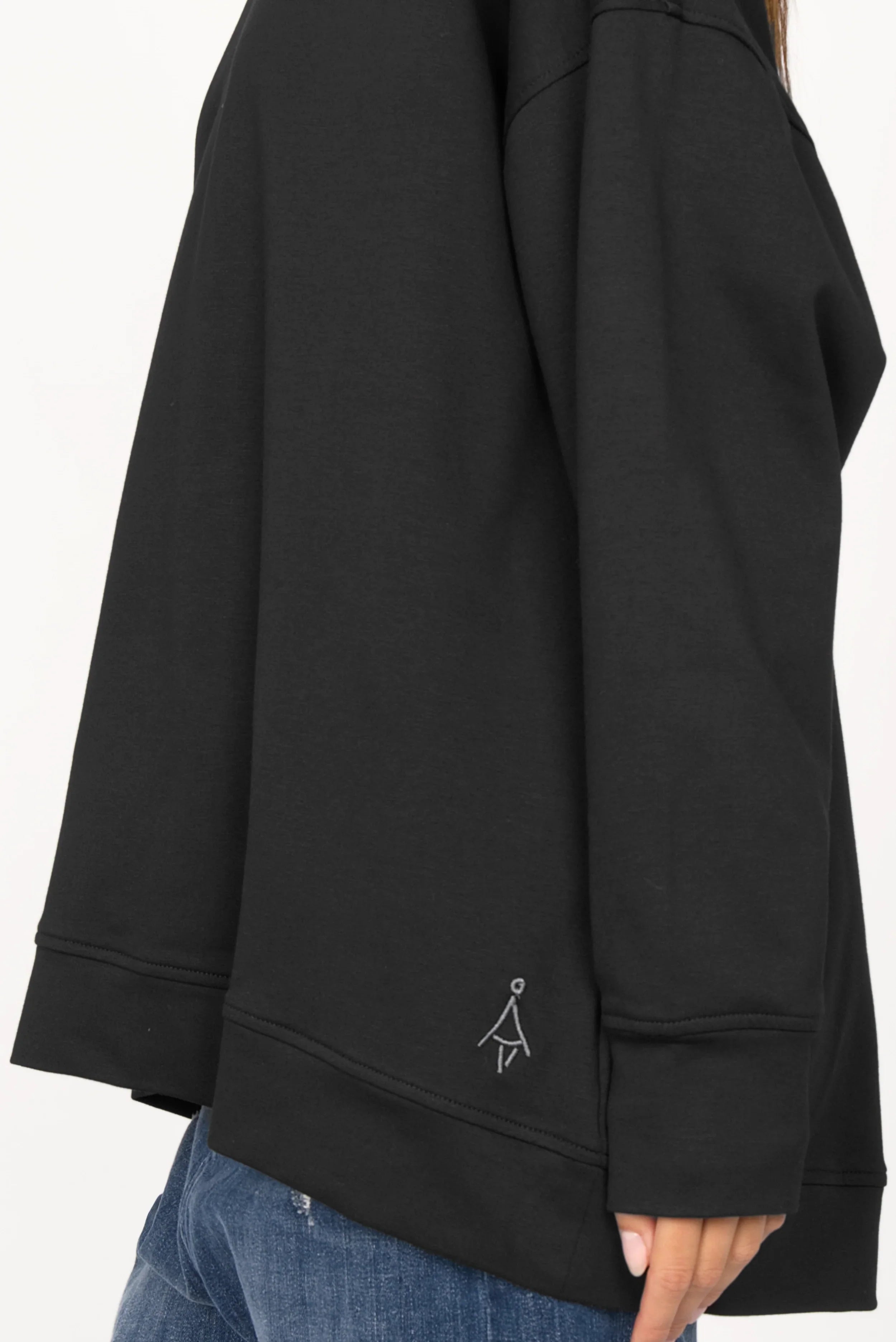 Black EIREL oversize sweater with A-line, tonal logo embroidery, and extended cuff sleeves