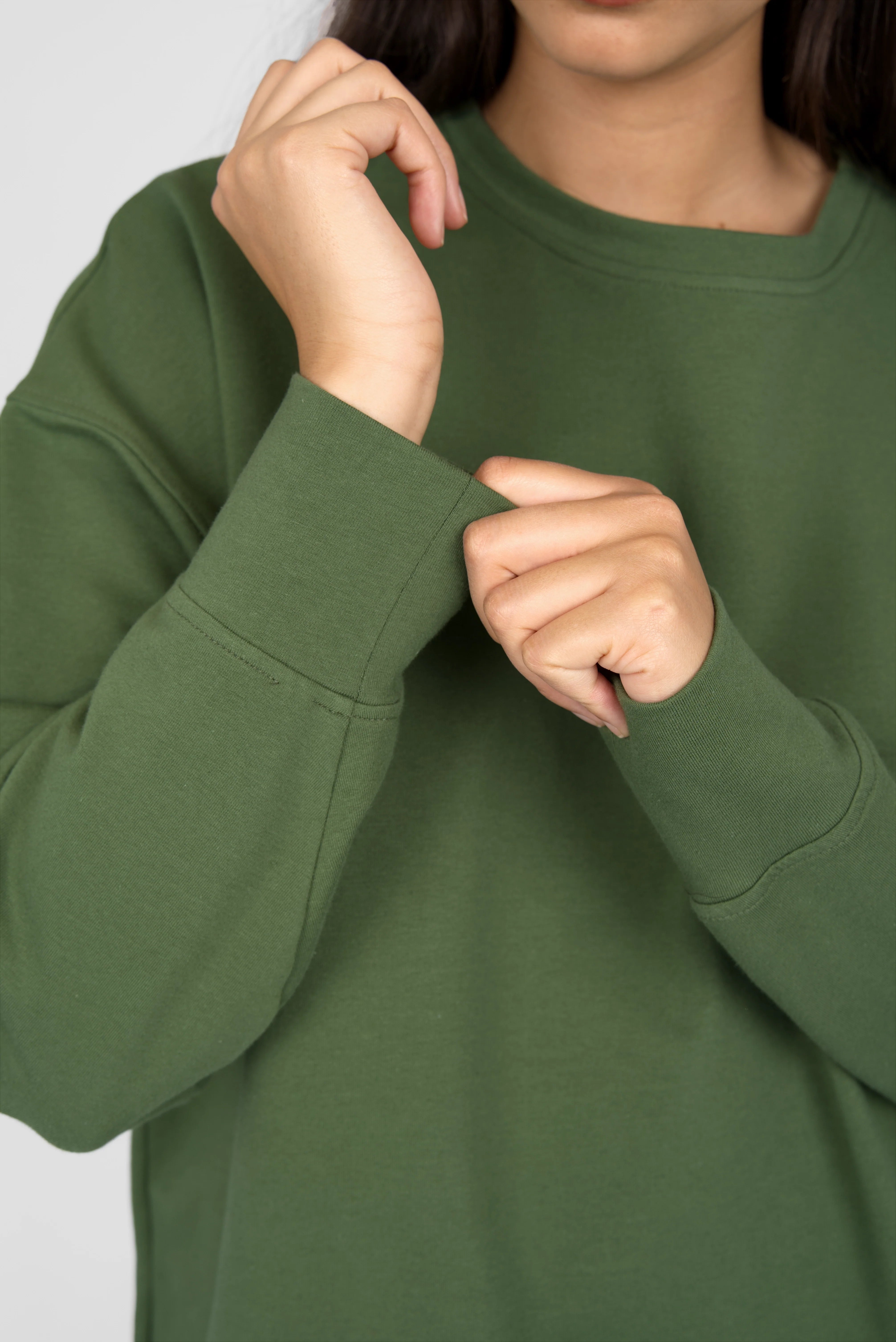 Green EIREL oversize sweater with round neckline, dropped shoulders, extended cuffs, and tonal logo embroidery.