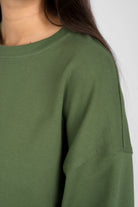 Green EIREL oversize sweater with round neckline and dropped shoulders, featuring tonal logo embroidery and extended cuffs.