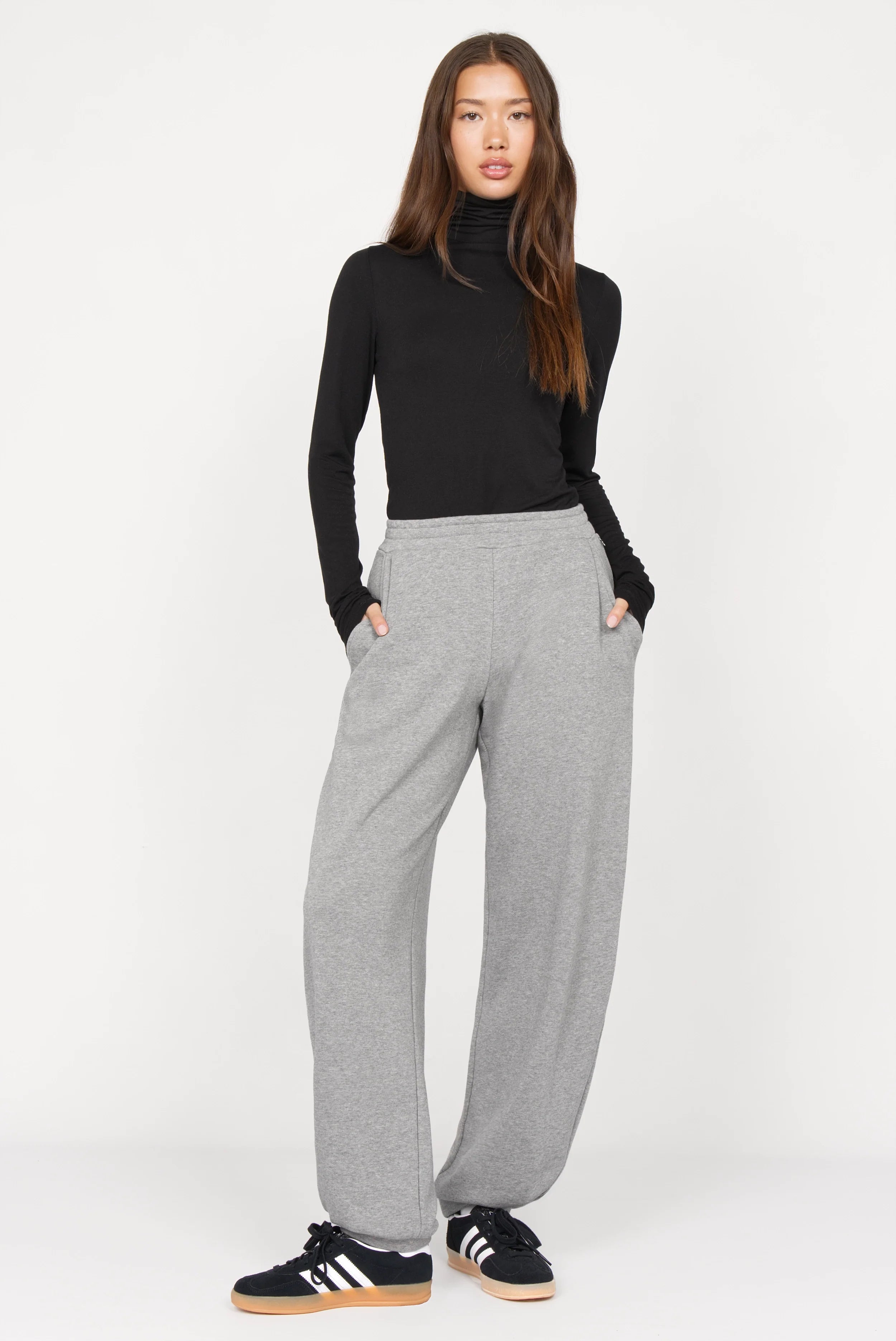 Woman wearing grey ELVEA O-Shape Sweathose with elastic waistband and relaxed fit