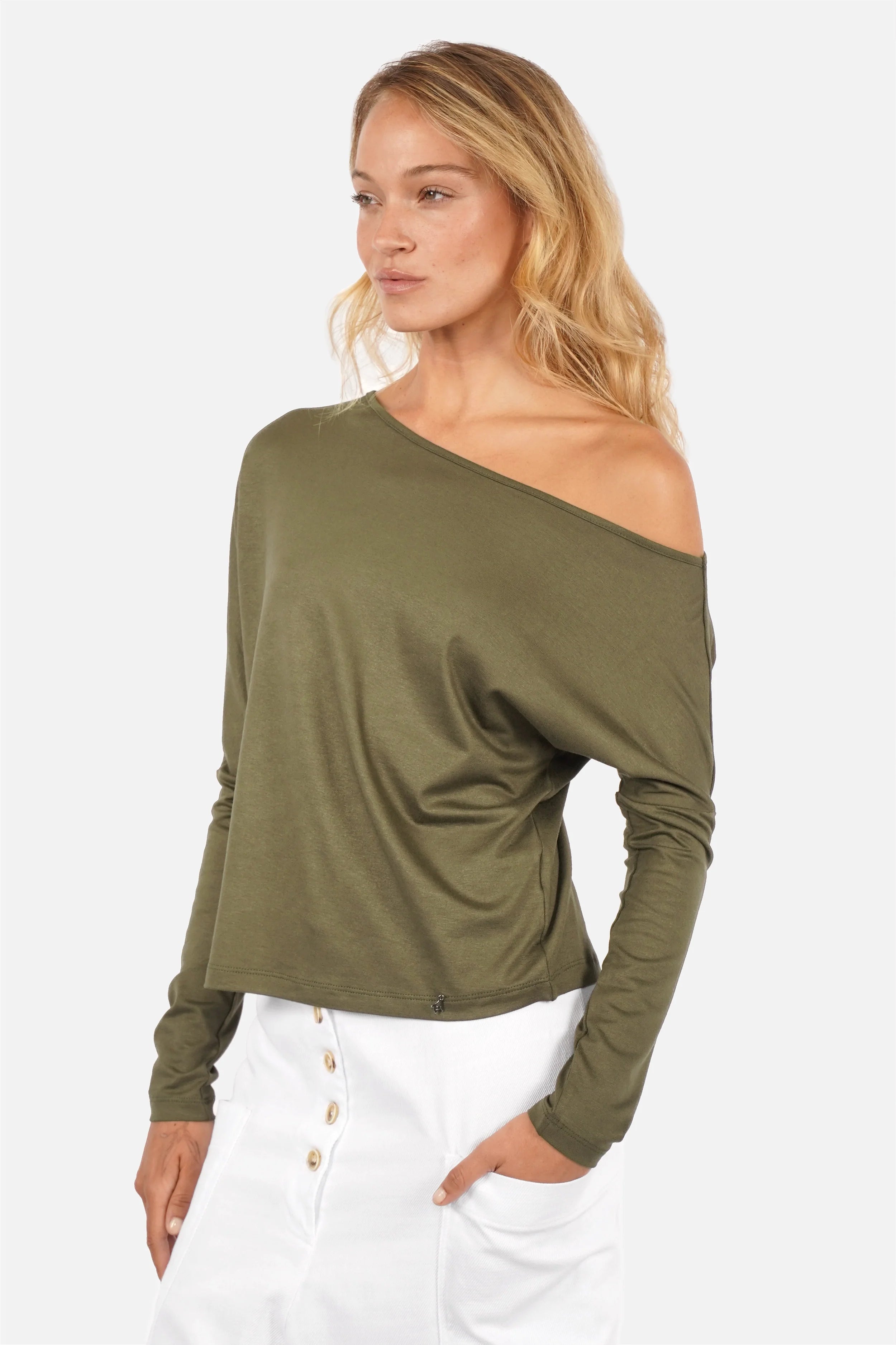 Woman wearing FRYA one shoulder longsleeve with asymmetrical neckline and batwing sleeves in lightweight viscose