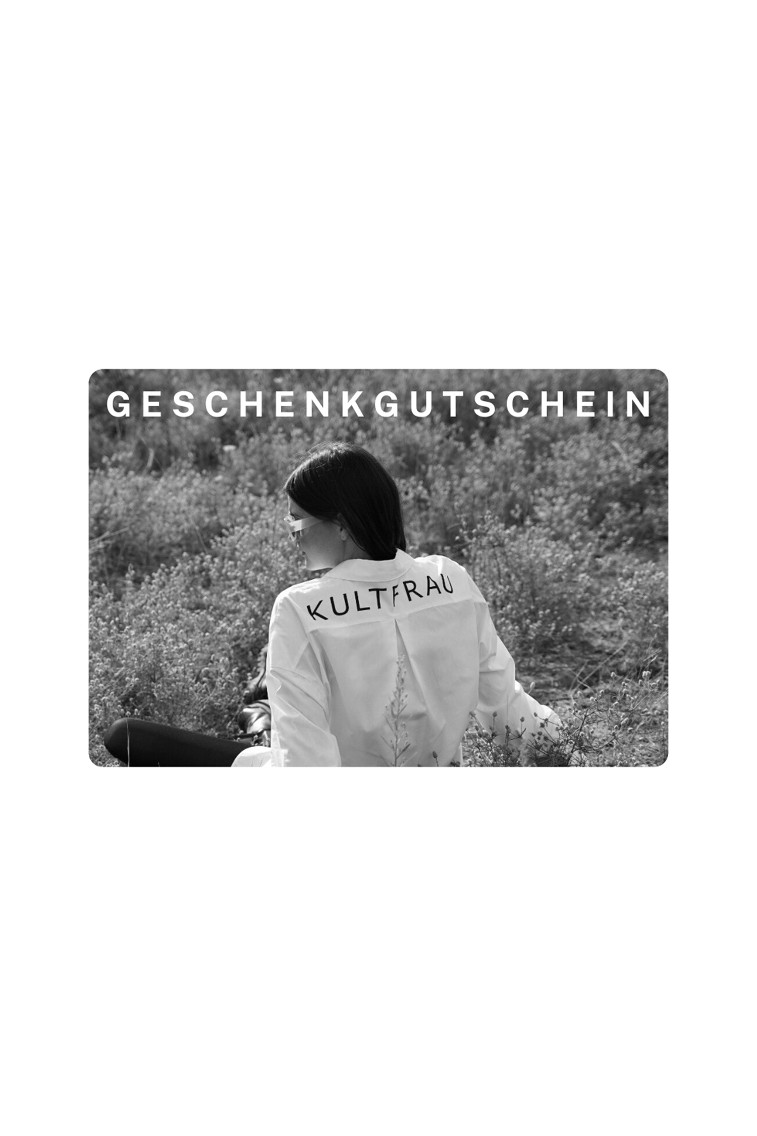 Geschenkgutschein with a woman wearing a Kultfrau jacket sitting outdoors in nature