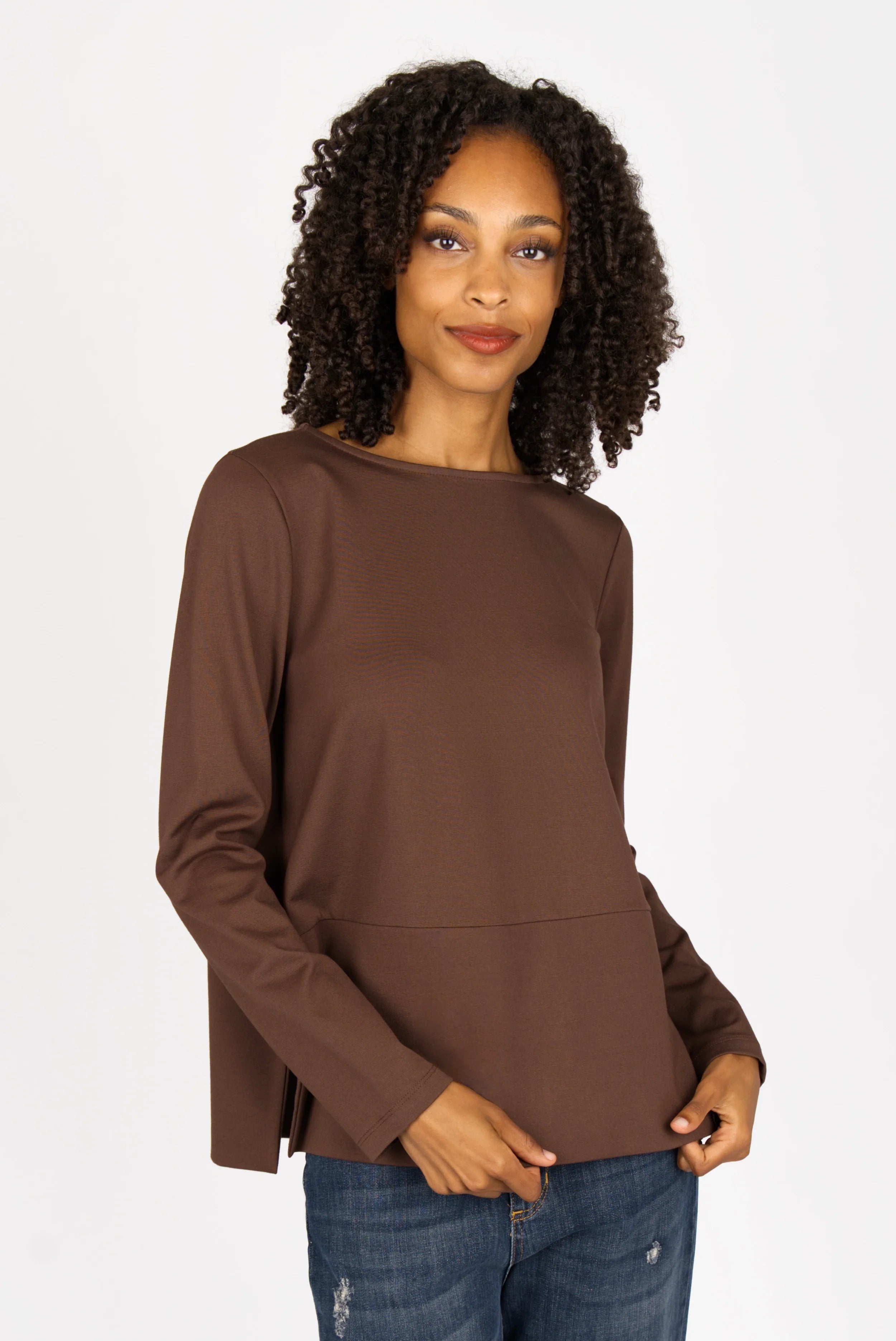 Woman wearing brown HAEIN Clean Jersey long sleeve top with U-boat neckline and side slits