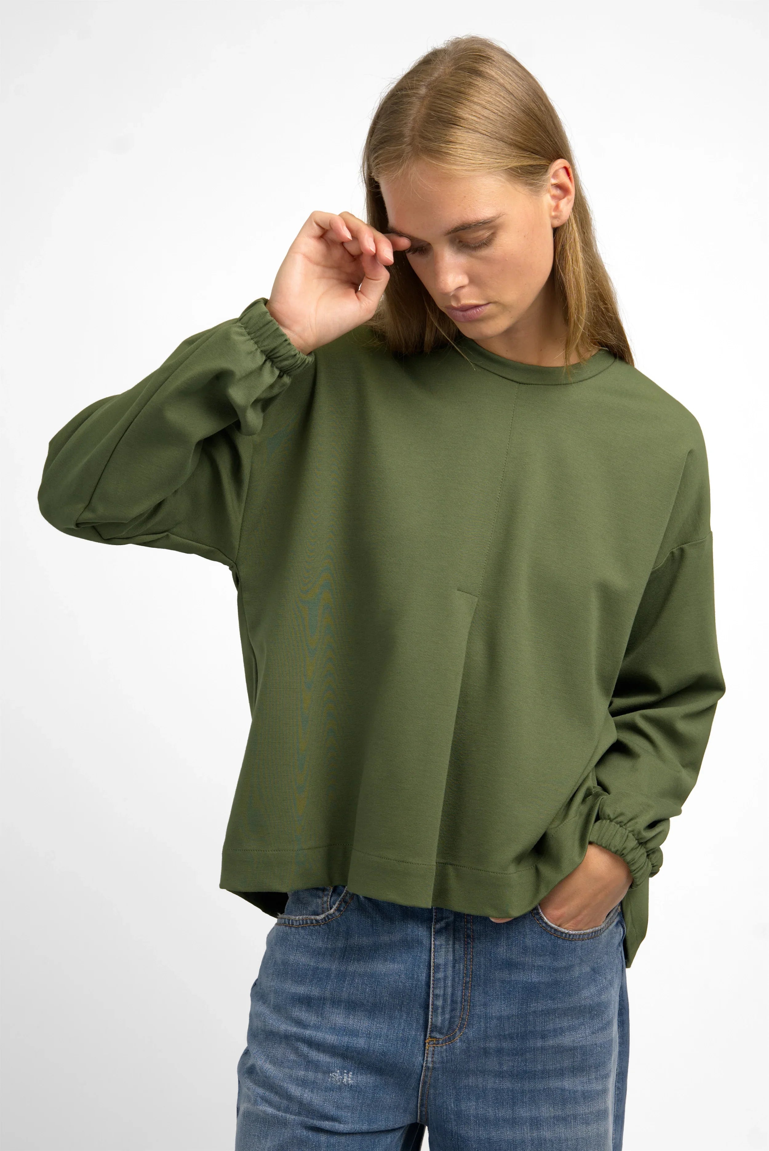 HAGLA Shirt in olive green with relaxed fit, round neckline, elastic cuffs, and back pleat detail