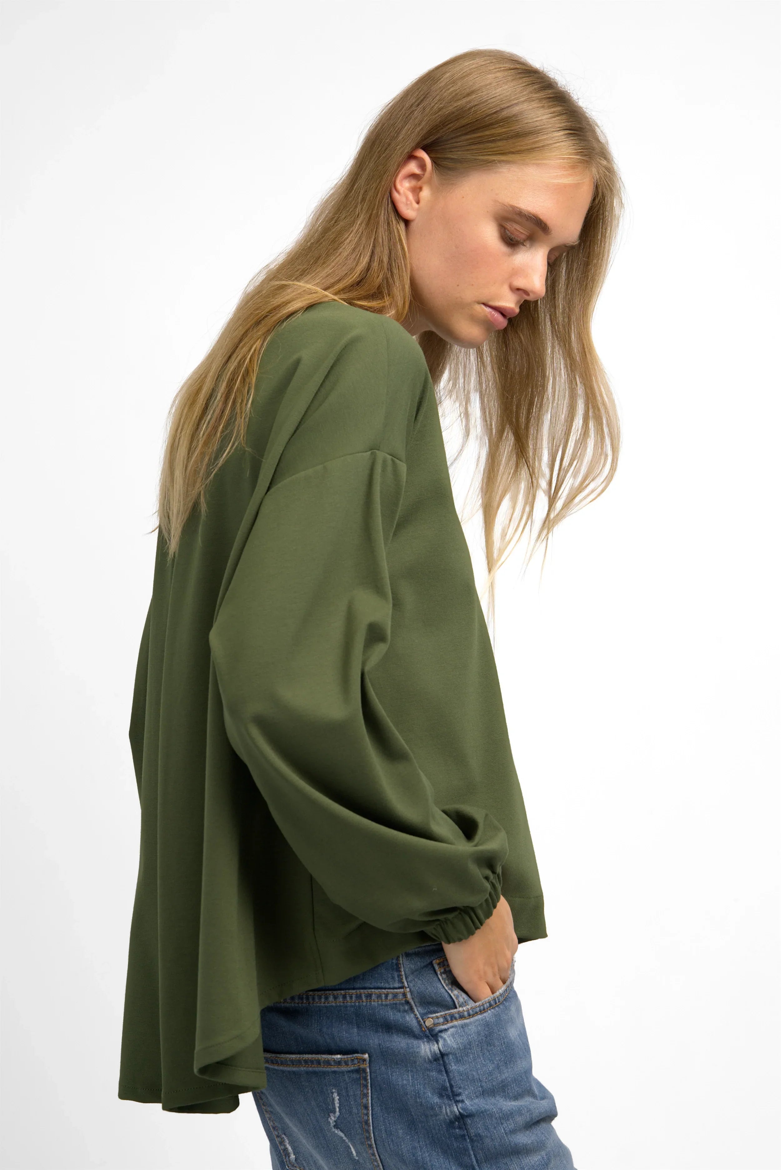 Women's HAGLA Shirt in olive green with relaxed fit, elastic cuffs, and longer back hem