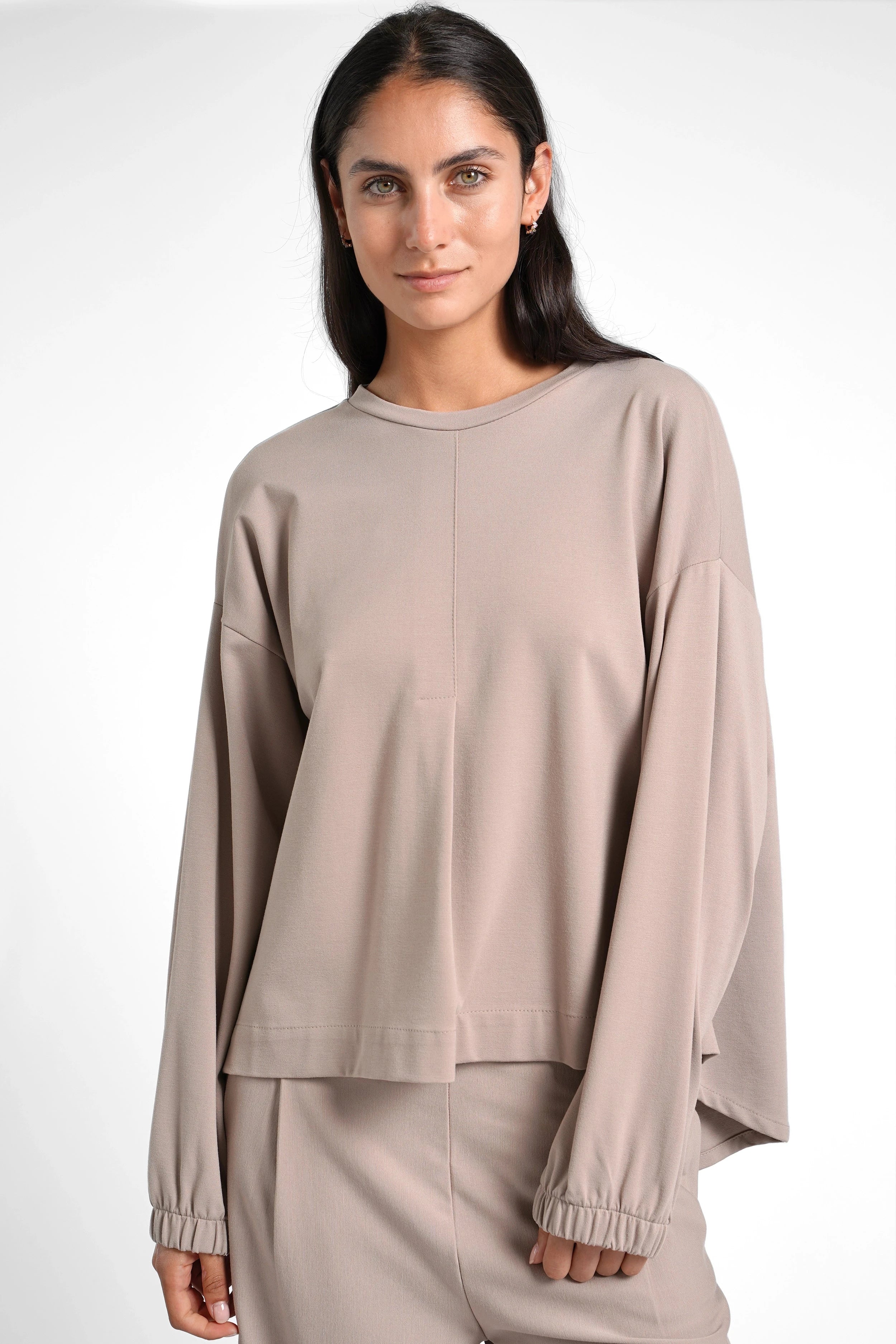HAGLA Shirt in soft heavy viscose mix with relaxed fit, round neckline, elastic cuffs, and subtle pleats, worn by model