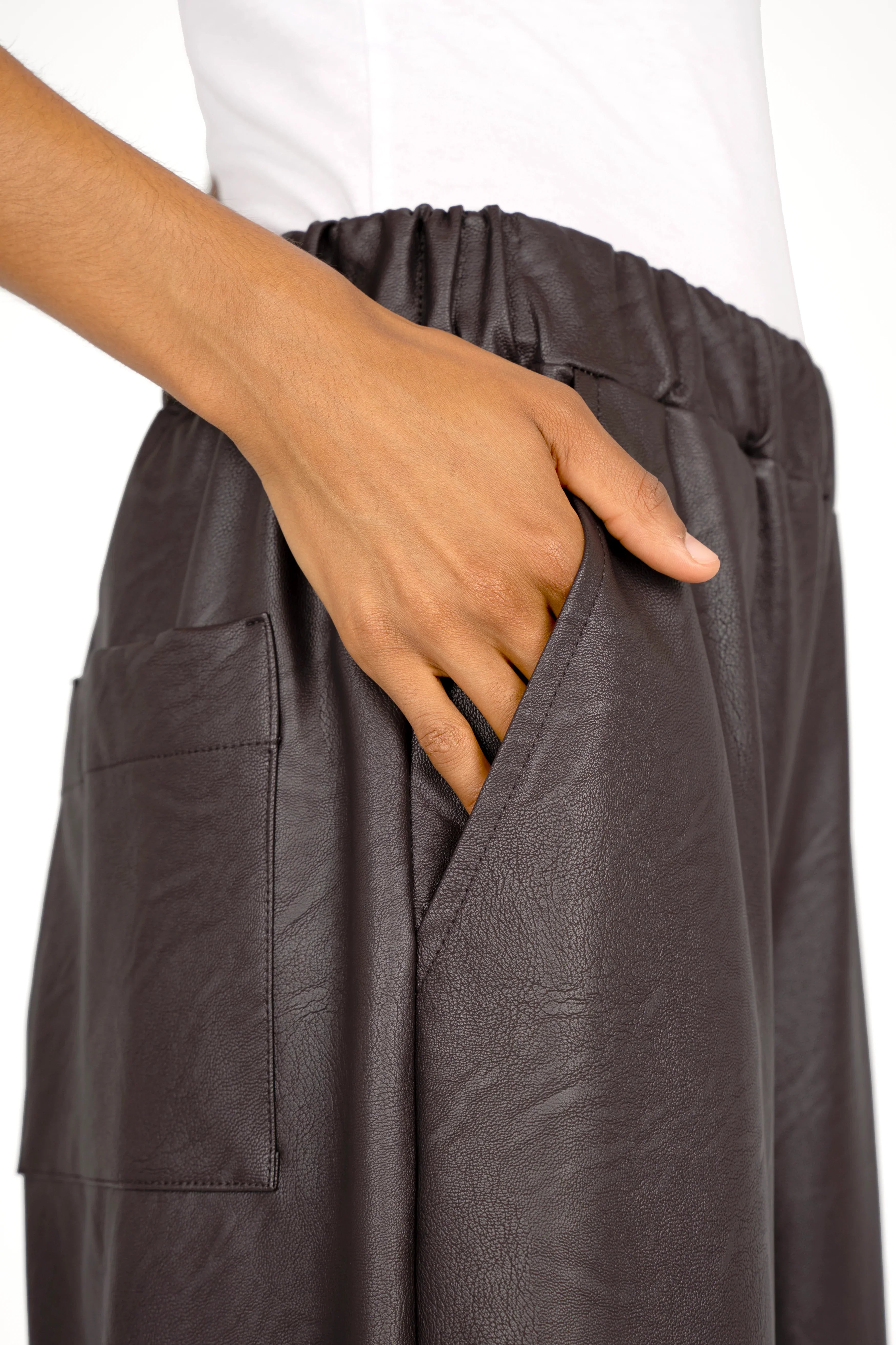 Close-up of HERA Wide Leg Hose in soft eco-leather with elastic waistband and side pockets.
