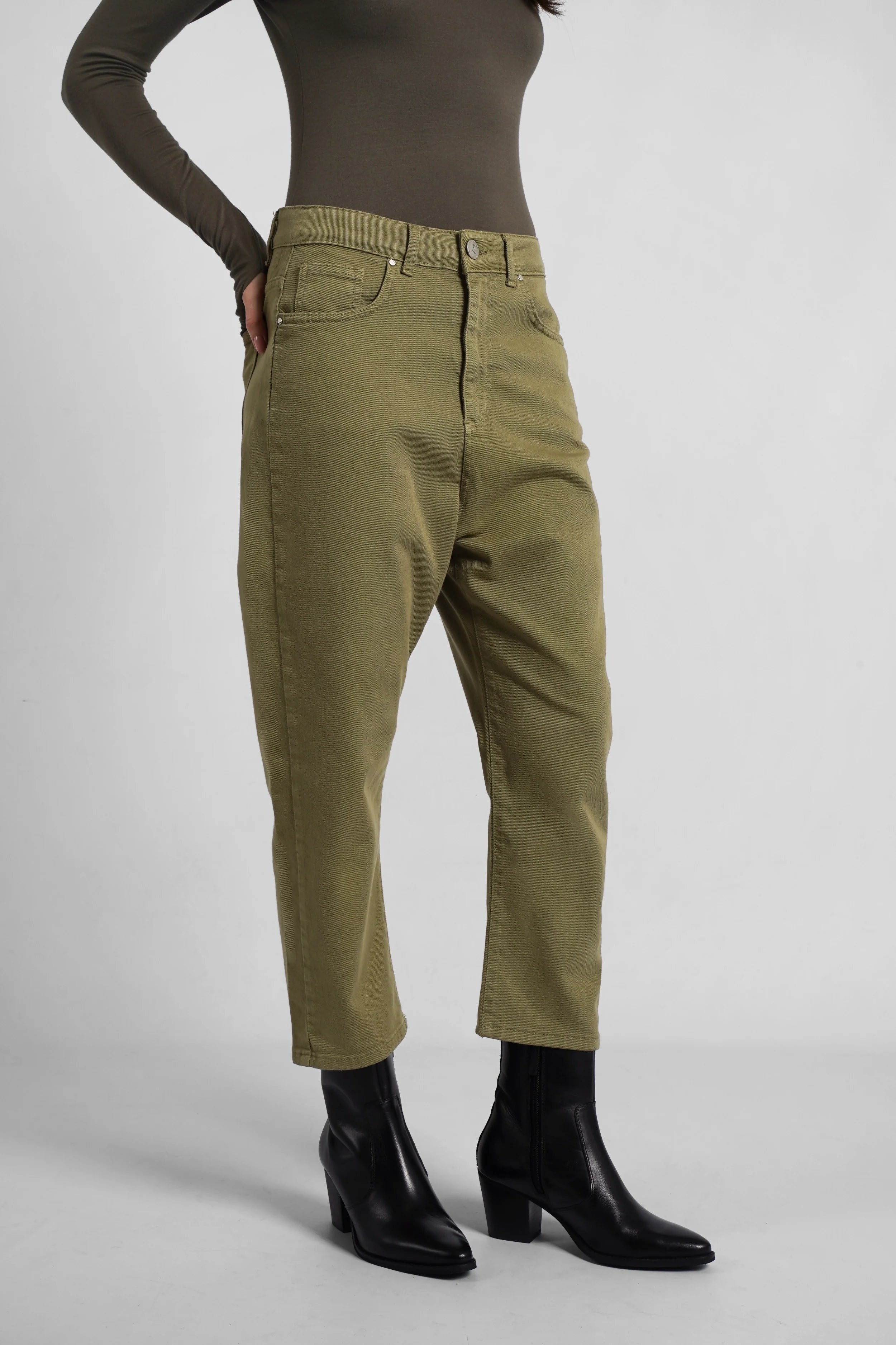 Olive green Jeany Baggy Jeans with relaxed fit and deep crotch, styled with black ankle boots