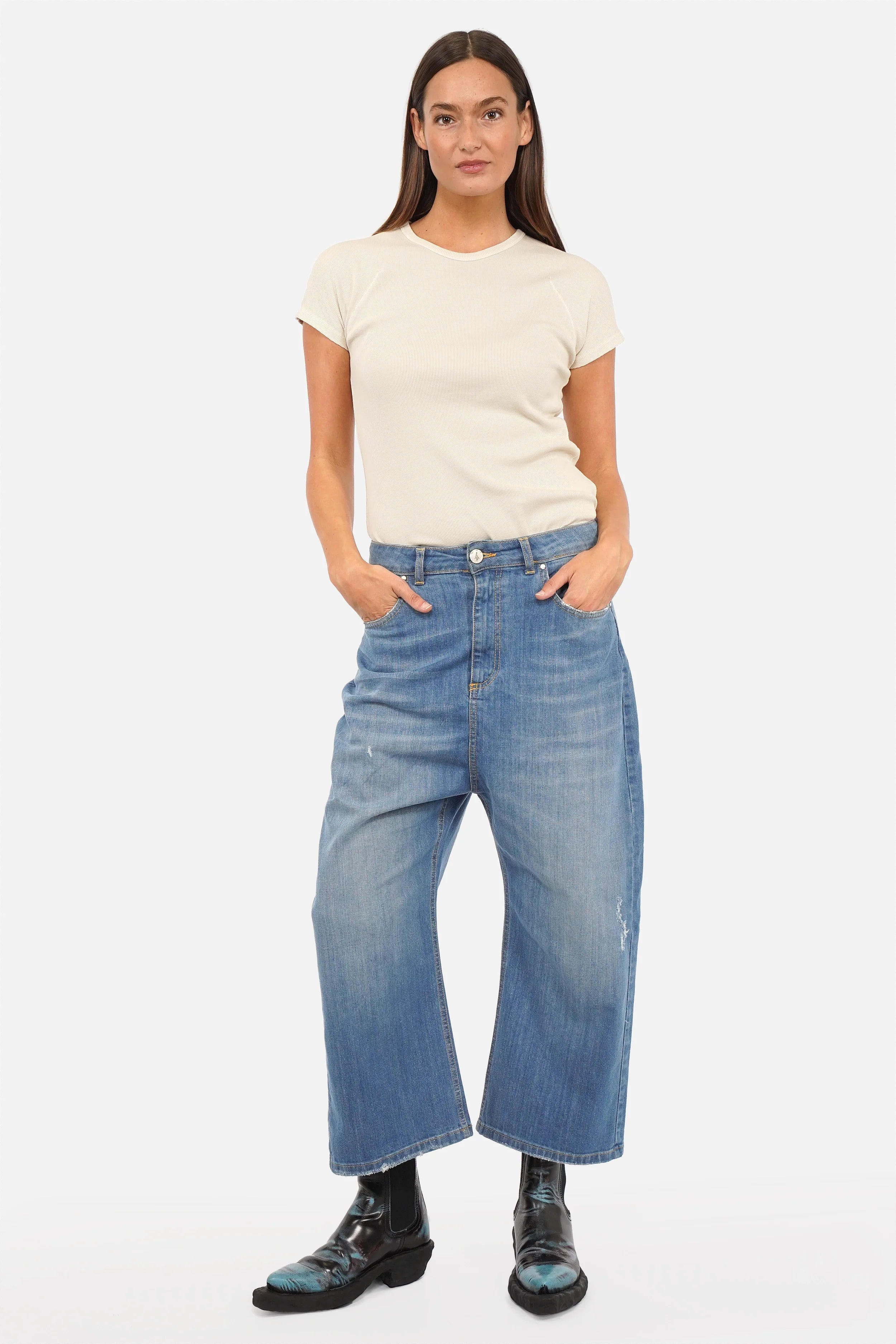 Model wearing Italian-made JENYA baggy jeans with destroyed wash and relaxed fit