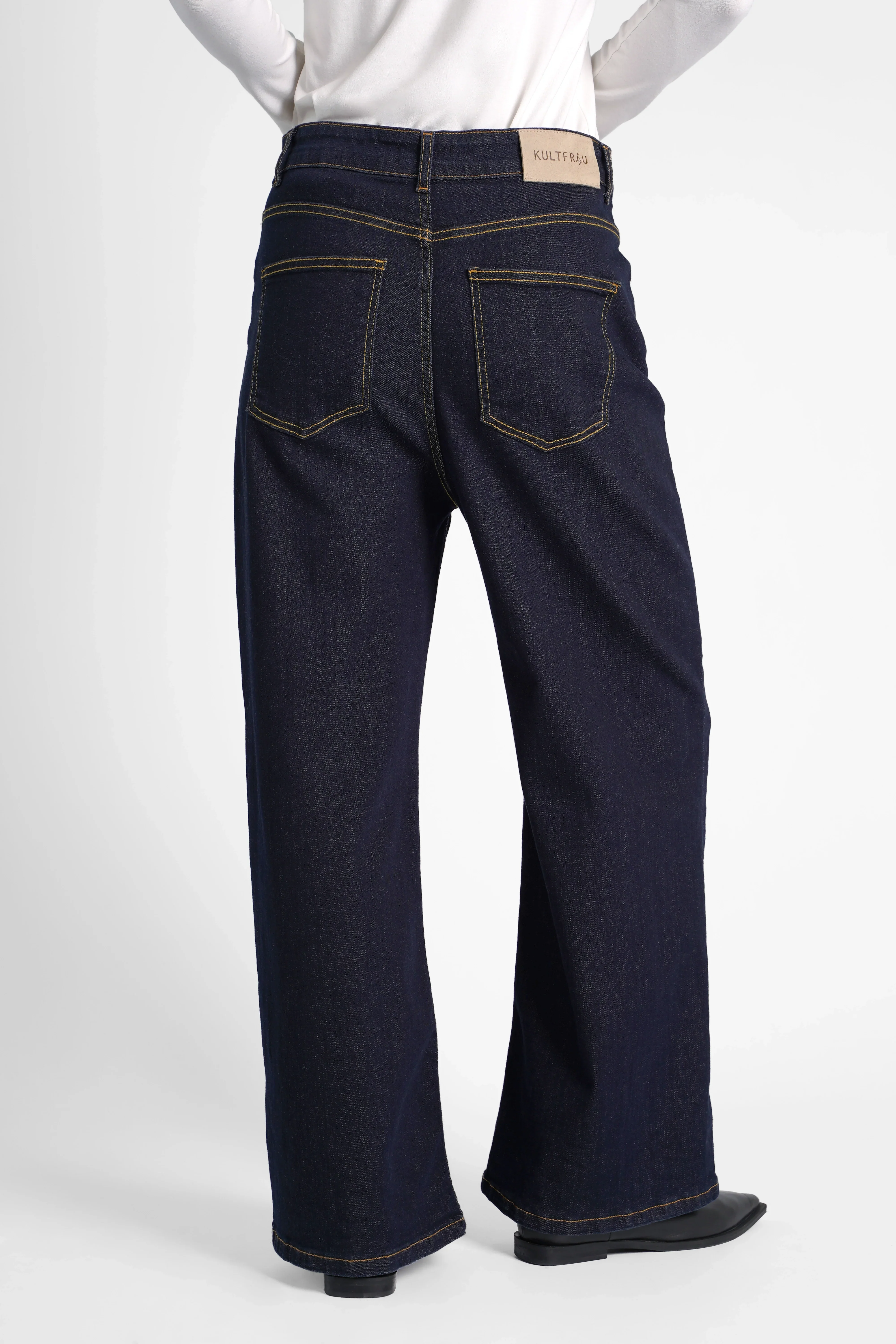 Back view of JOOSY Wide Leg Jeans in dark raw blue denim with relaxed fit and wide straight legs