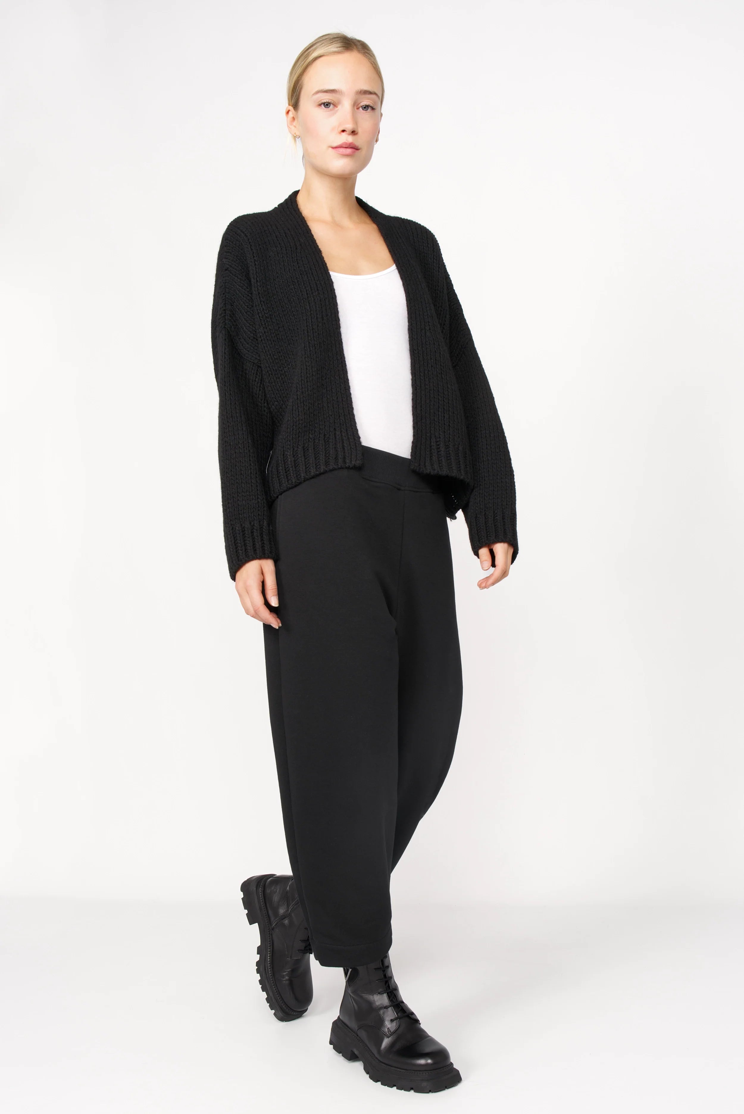 Woman wearing black JOUDY Carrot Jogpant with cropped carrot fit and elastic waistband