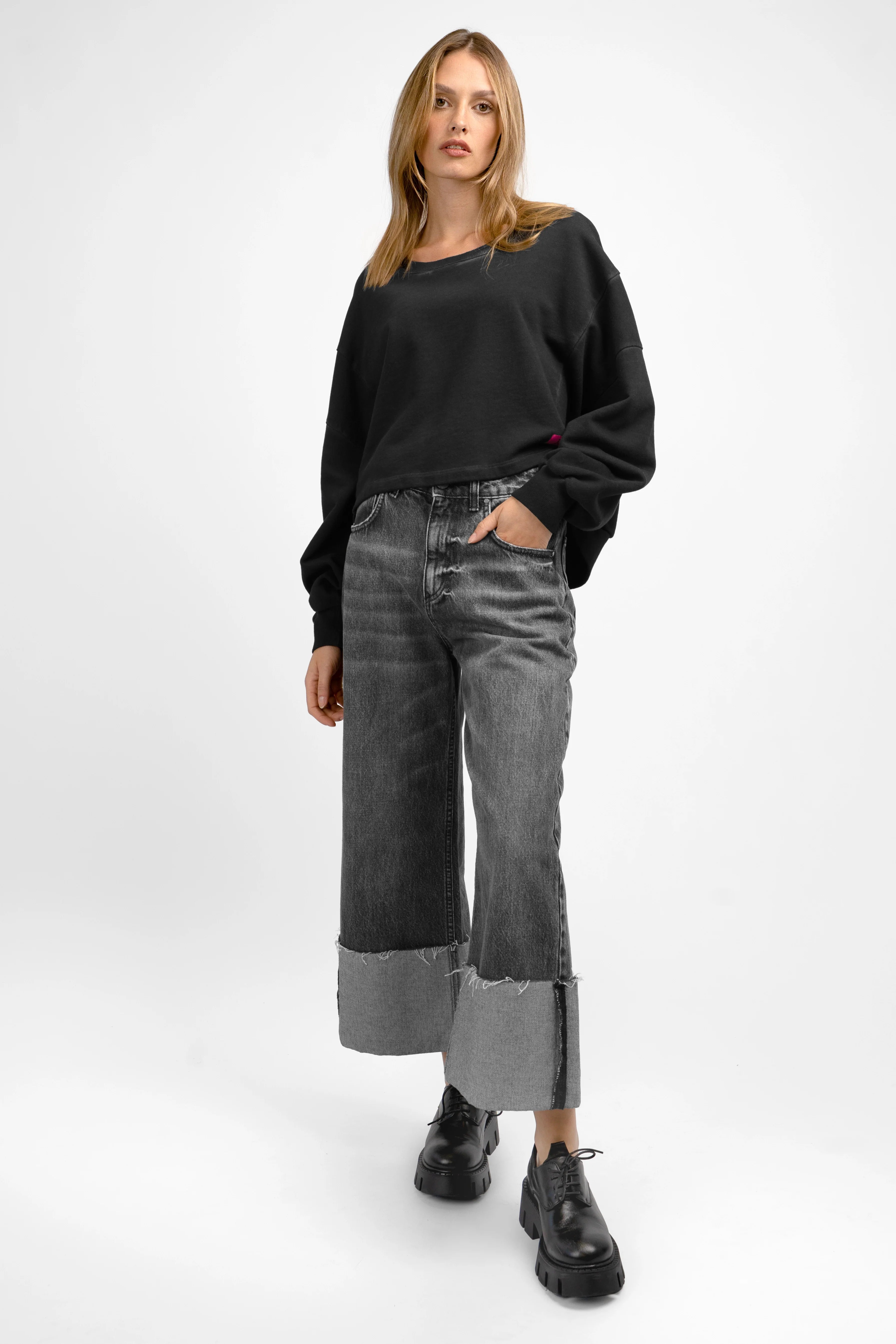 KERY Cropped Sweater black oversized fit with U-boat neckline and extended back hem on model
