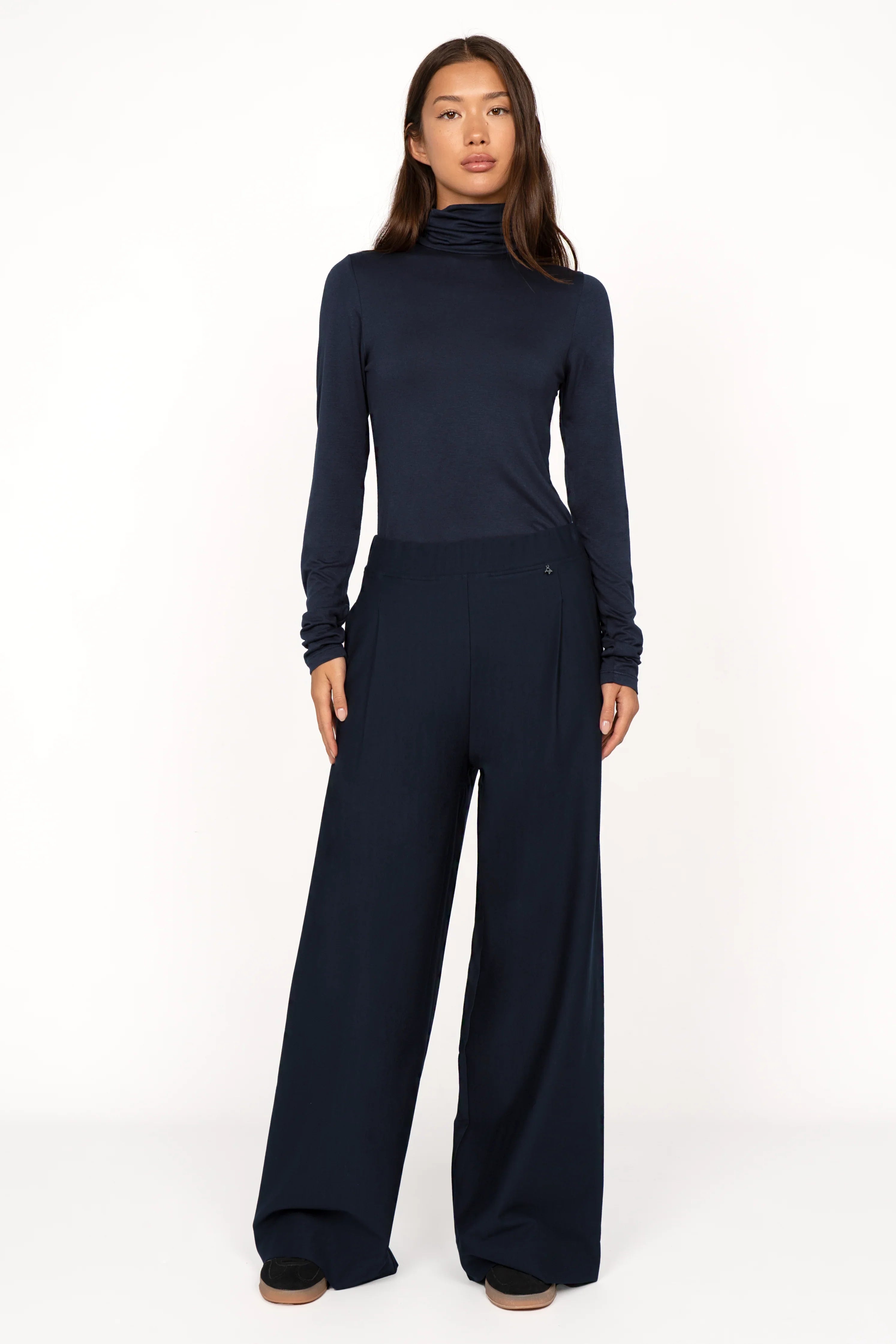 Woman wearing navy KLARA.K Wide Leg Pants with elastic waistband and side pockets paired with matching long sleeve top