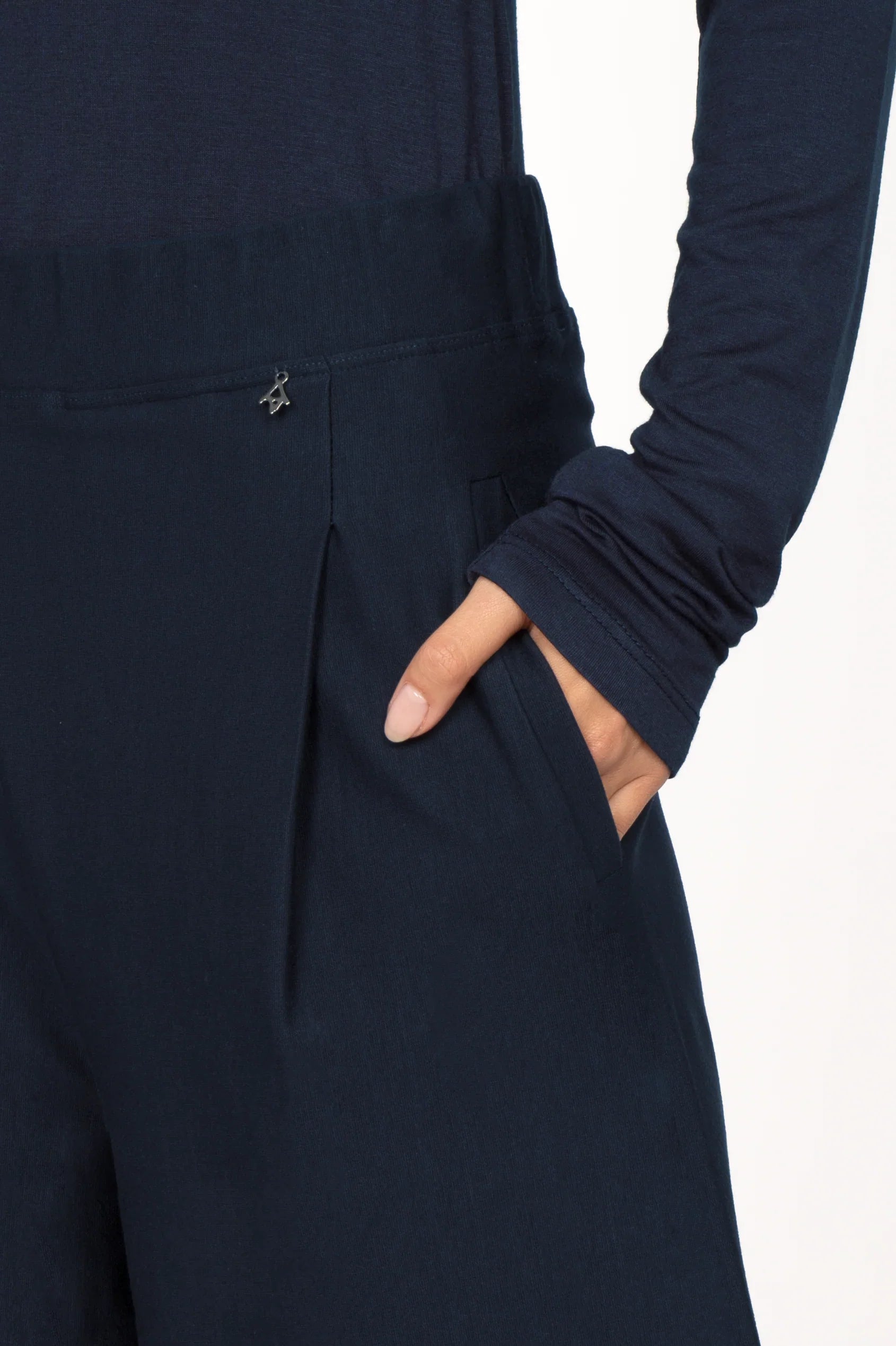 Close-up of KLARA.K Wide Leg Pants with elastic waistband, side pockets, and subtle pleats in navy blue viscose mix fabric