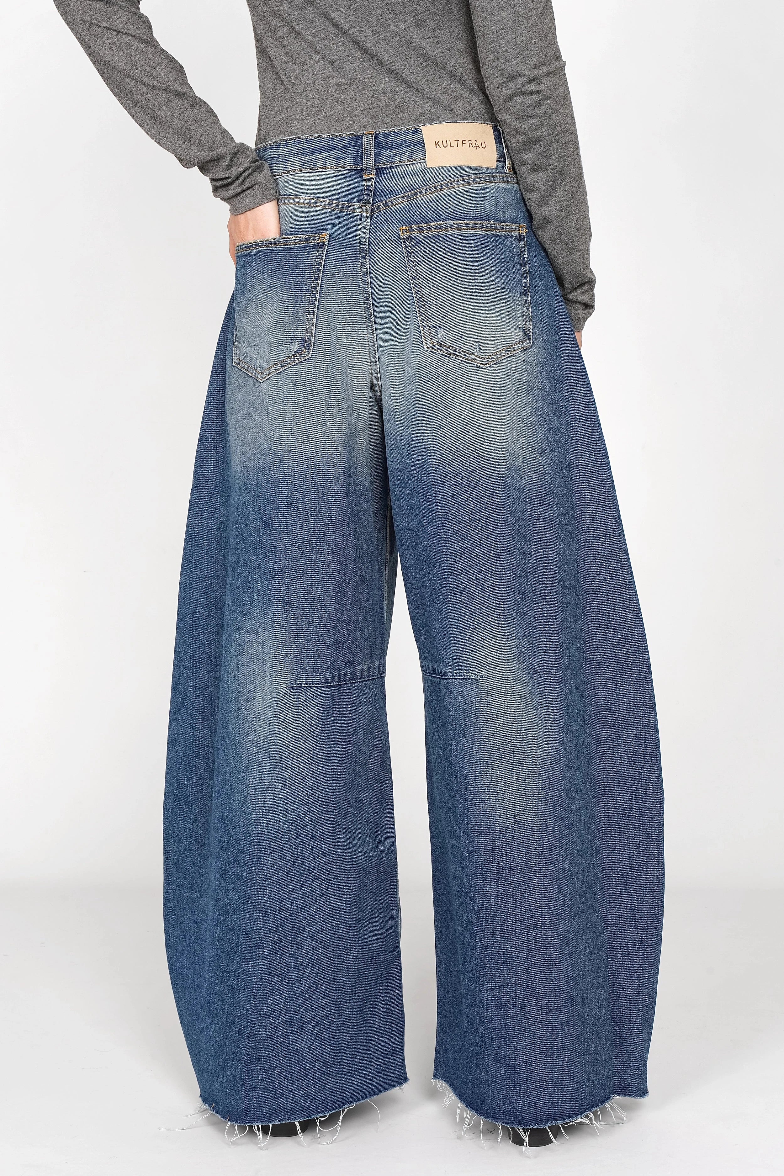 Blue high-waist wide barrel jeans with relaxed fit, raw-cut hem, and subtle whisker and faded details