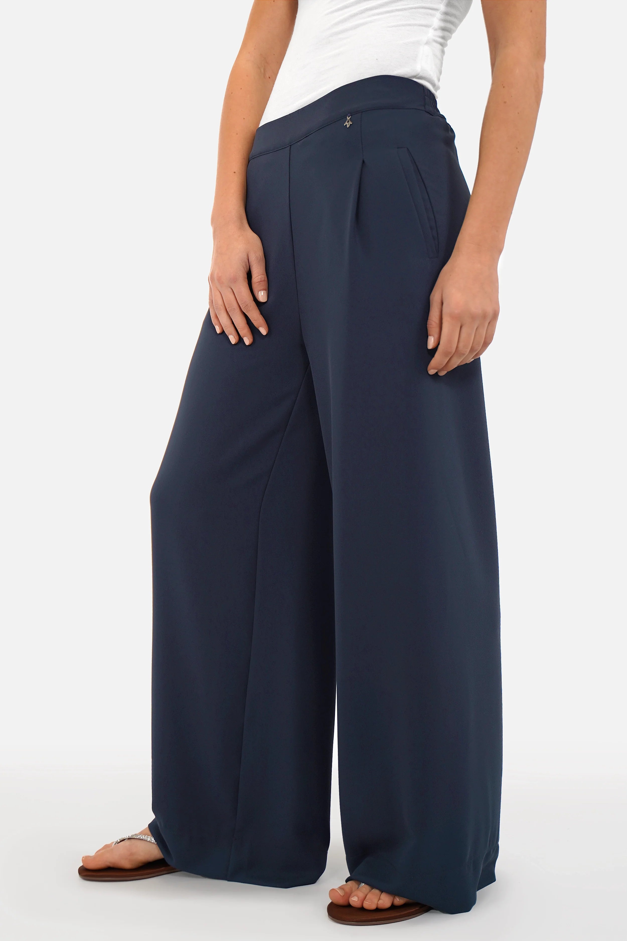Woman wearing LARA.K Wide Leg Pants in lightweight, wrinkle-resistant fabric with elastic waistband and side pockets