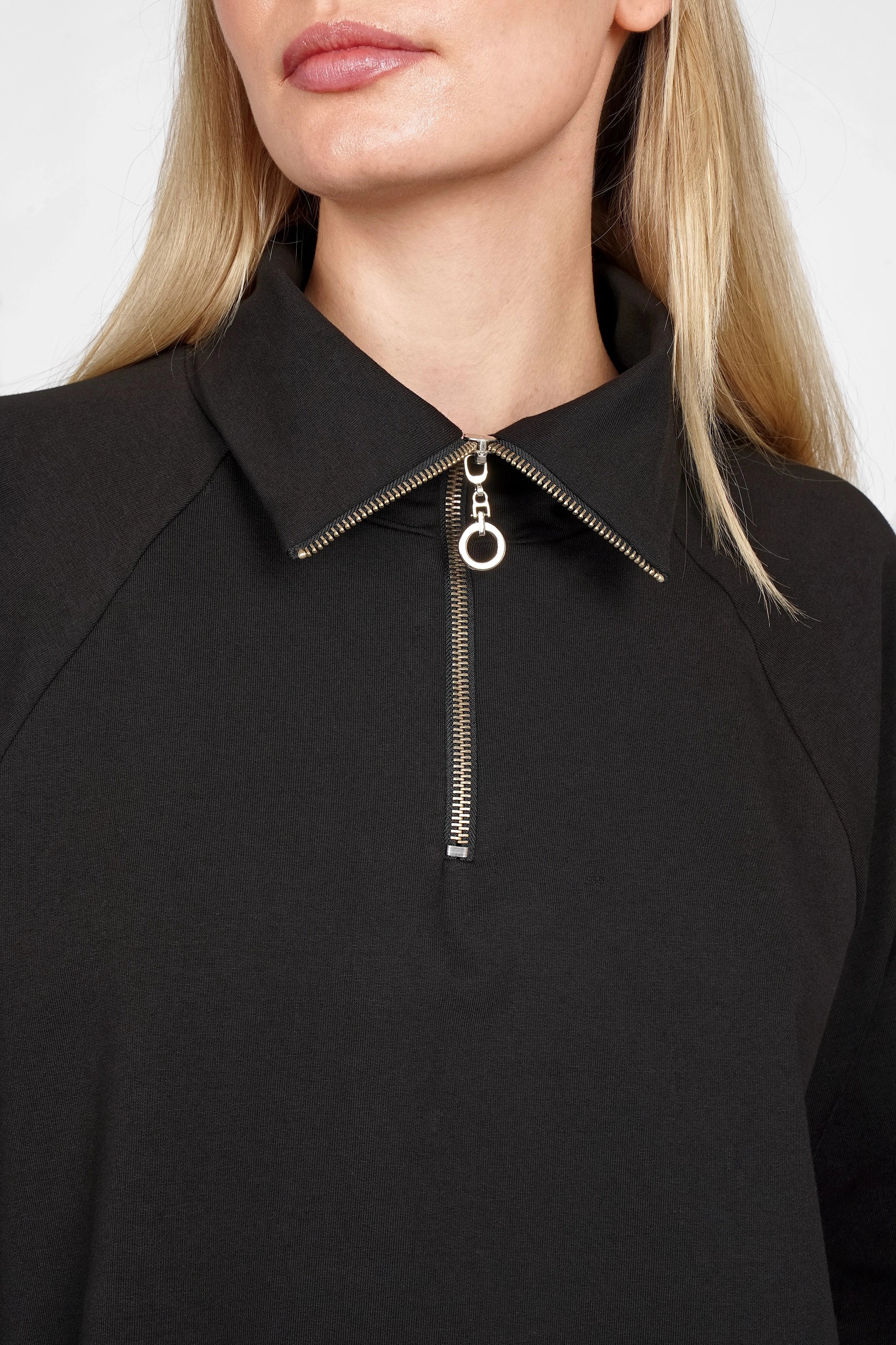 Black LENIA Troyer-oversize sweater with half-zip, standing collar, and raglan sleeves on woman