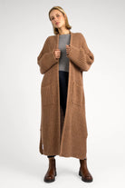 LOLA Strickcardigan oversized knit cardigan with open front and front pockets worn by model