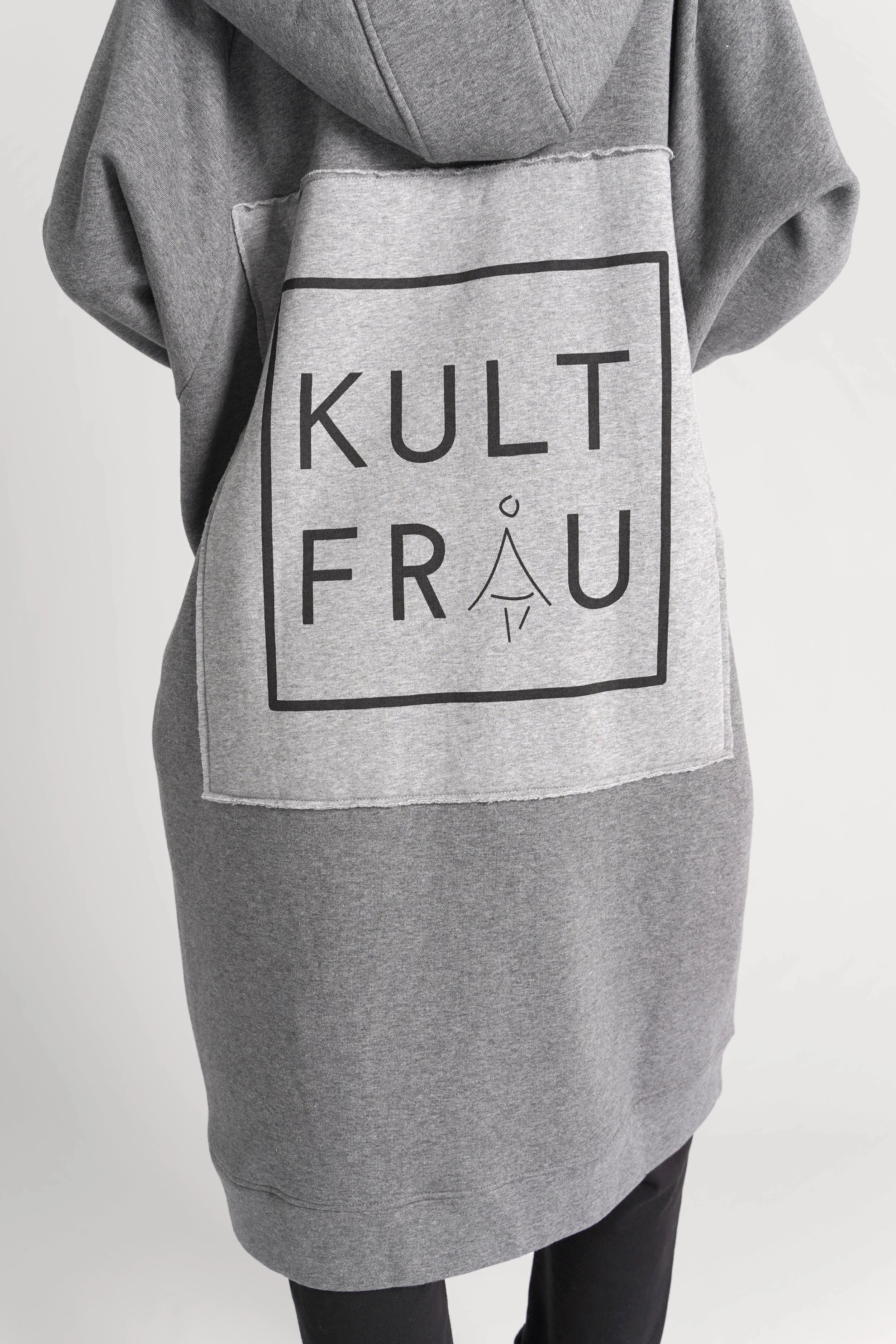 Grey oversized Longzip-Hoodie with two-way zipper, hood, side pockets, and stitched logo patch on back