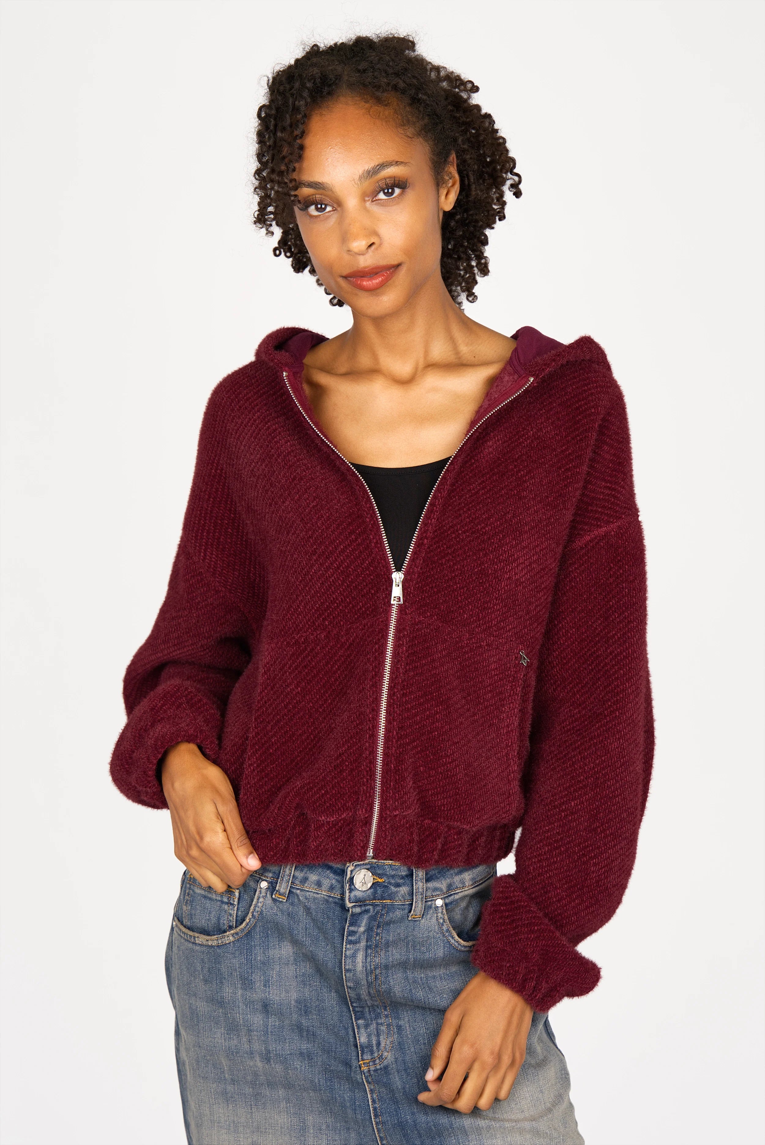 Burgundy zip-hoodie with soft short fur texture, cropped length, relaxed fit, and kangaroo pocket