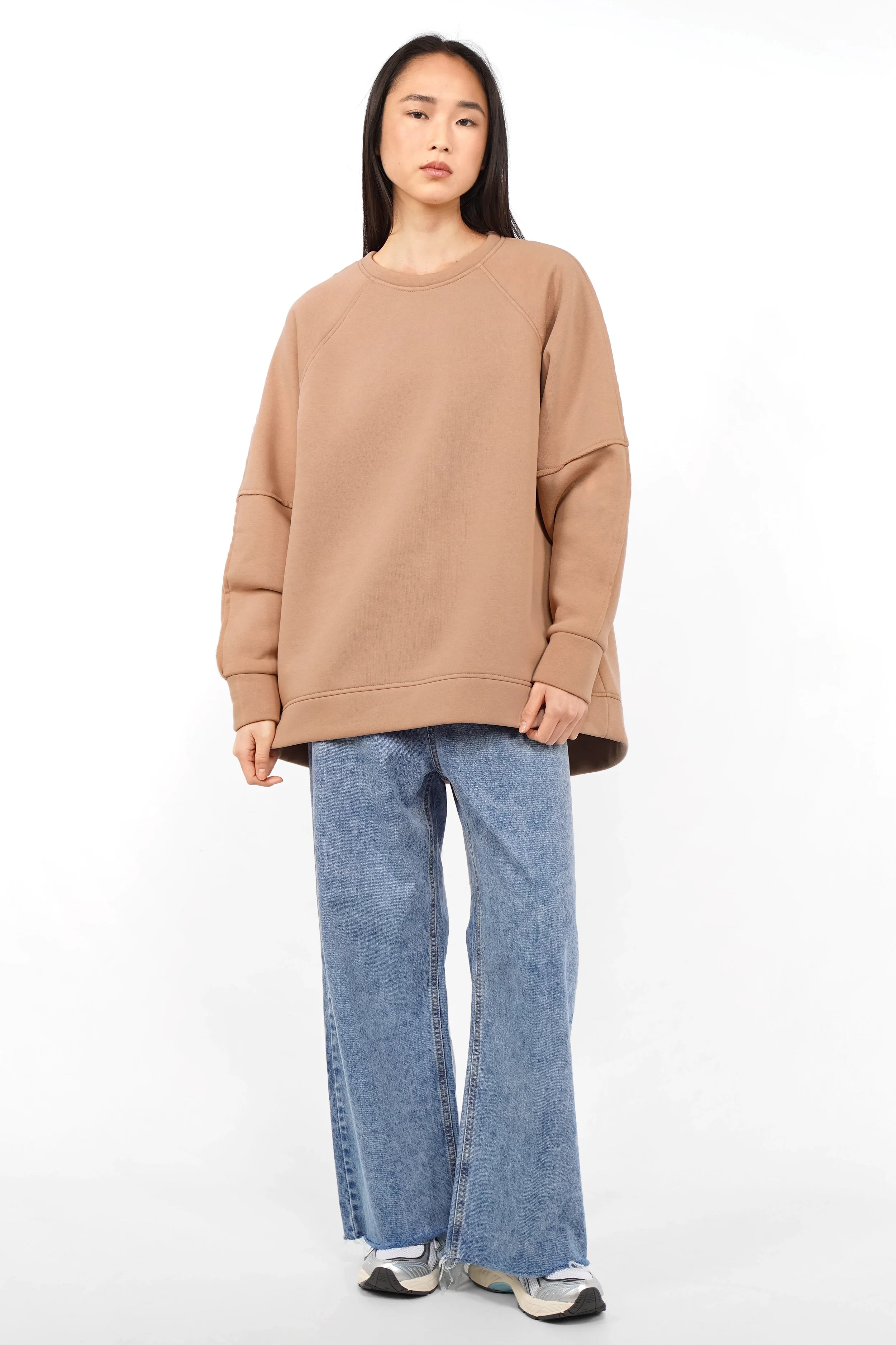 NAIRA Cozy Sweater in soft brushed cotton with A-line silhouette and relaxed fit worn with jeans