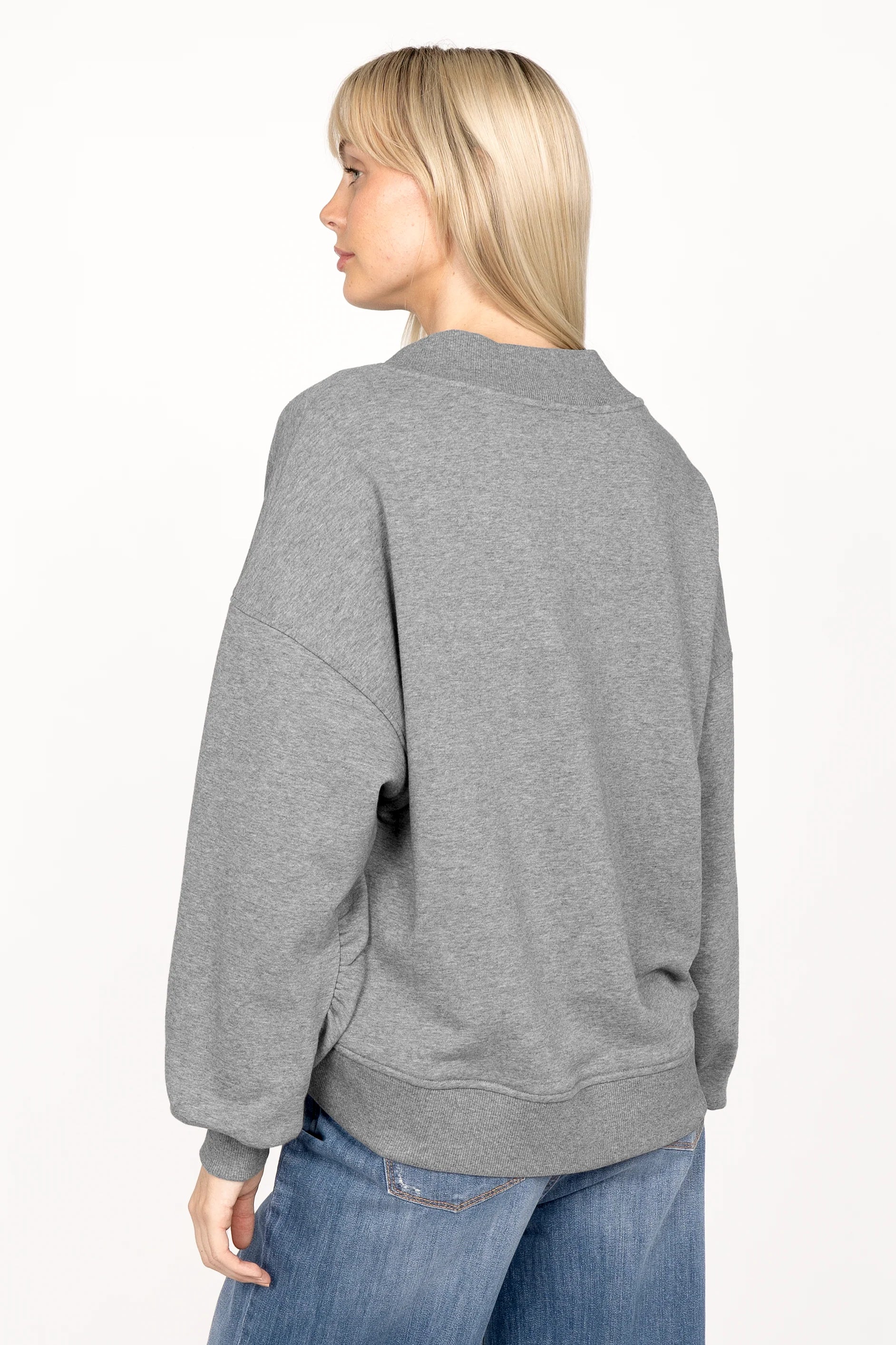Grey SEREA Sweater with deep V-neck, ribbed cuffs and hem, relaxed fit, worn by model from back view