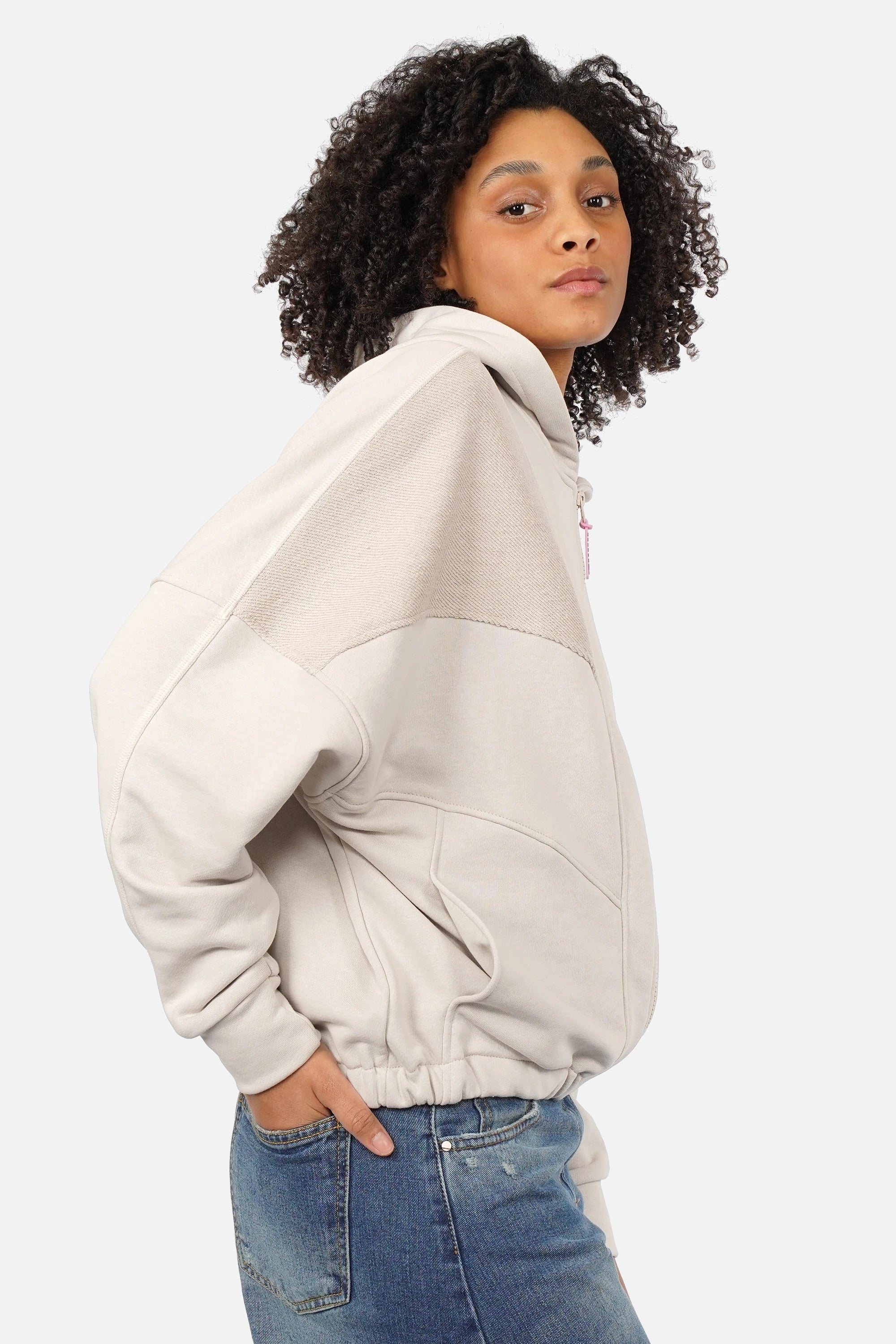 Oversized zip-hoodie with panel seams, hood, tone-on-tone zipper with pink logo, dropped shoulders, wide cuffs, side pockets, elastic hem, longer back length, model wearing size S