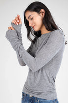 Woman wearing grey SUJIN Longsleeve with boat neckline and ruched sleeves in slim fit design