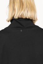 Back view of black SYNNI Känguru-Tasche hochkragen dress with loose standing collar and smooth compact viscose jersey fabric