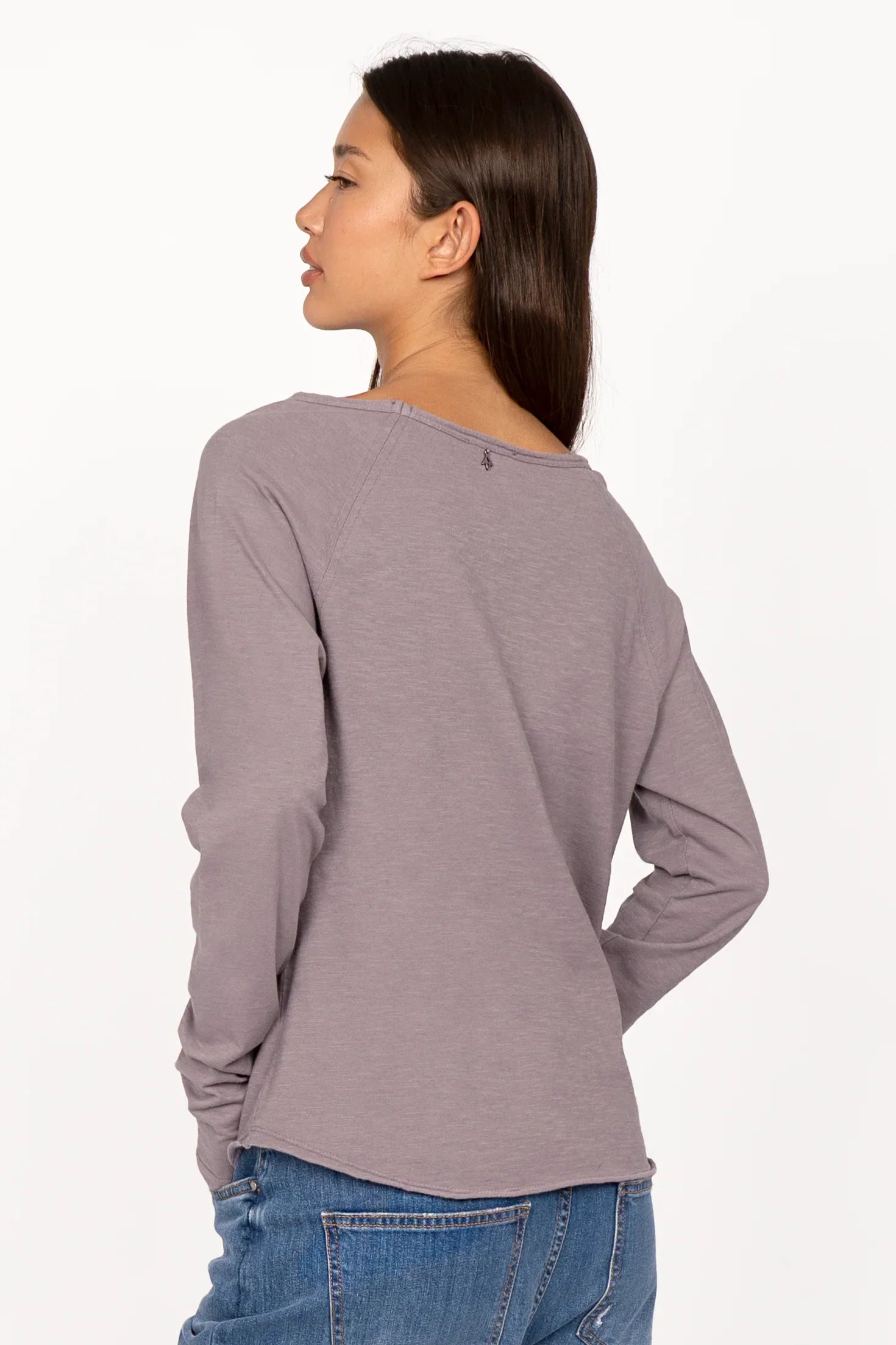 Woman wearing mauve TEHI Longsleeve with long raglan sleeves and open edge neckline, viewed from the back