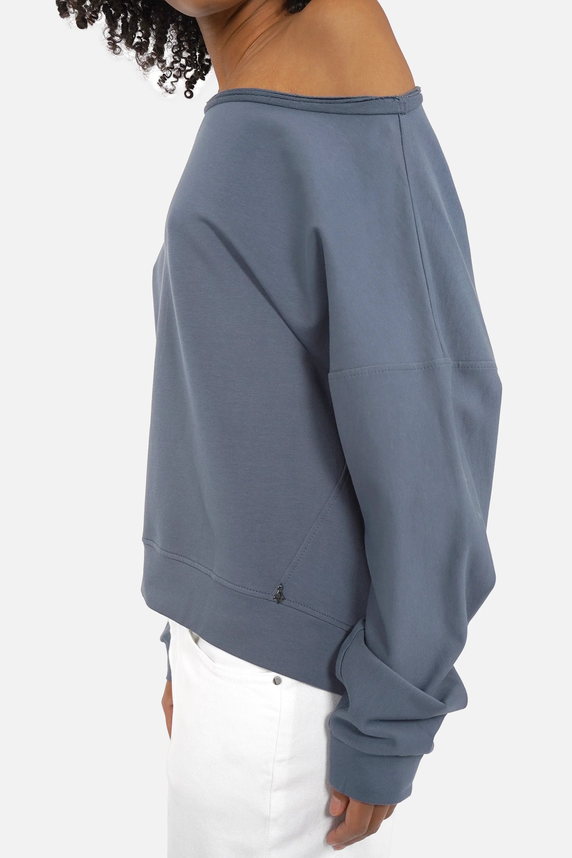 One Shoulder Sweater with wide neckline, soft fabric, extended cuffed sleeves, loose fit, longer back hem