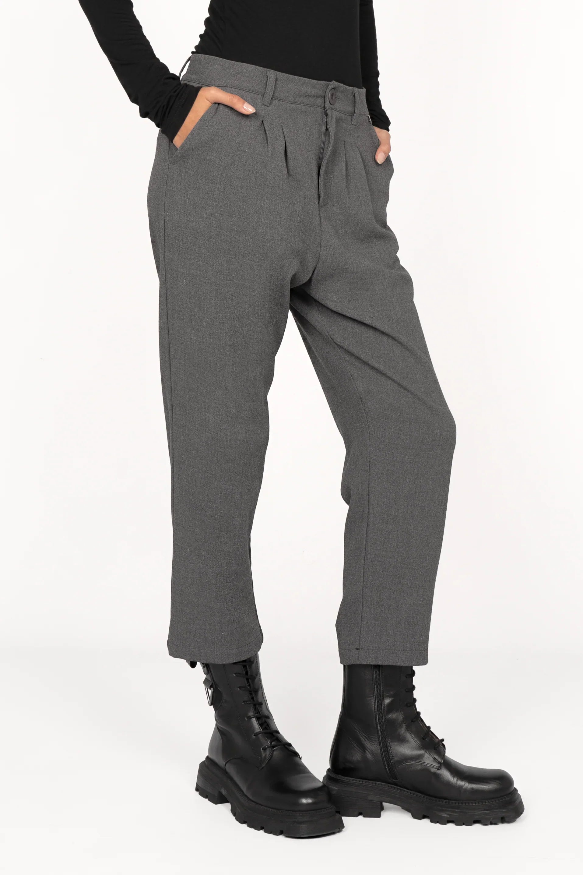 TINKE cropped fit gray pants with pleats and zipper closure worn with black boots