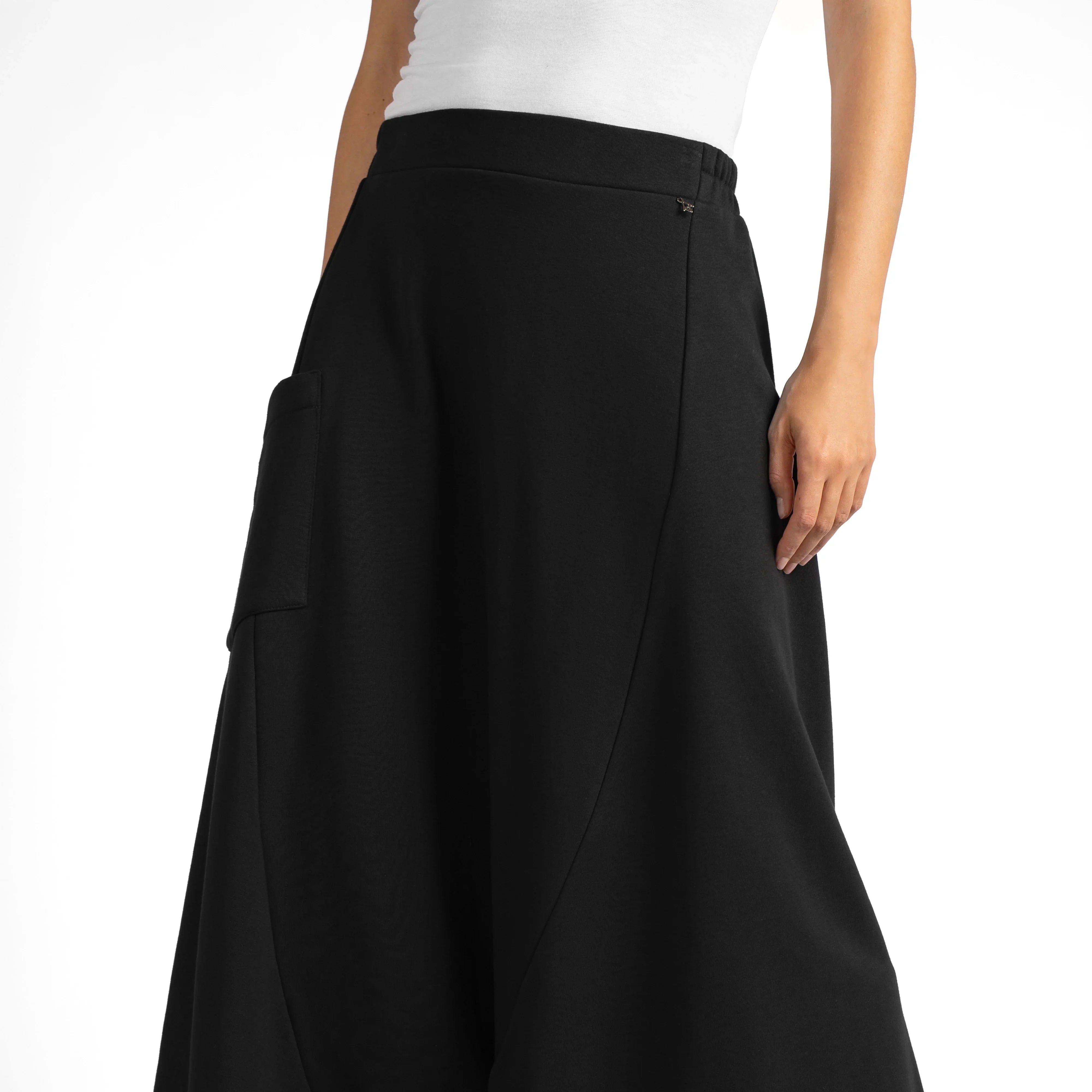 Black radical wide Hosenrock aus Sweat with asymmetrical front pocket and smooth waistband, made from compact soft sweat fabric with structured seams.