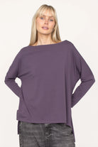 AMALEA Relaxed Fit purple long sleeve shirt with boat neckline, dropped shoulders, side slits, and extended back hem on model