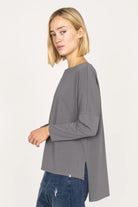 AMALEA Relaxed Fit gray longsleeve with boat neckline, dropped shoulders, side slits, and extended back hem.