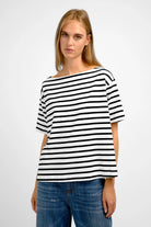 Woman wearing AILIE T-Shirt striped black and white viscose jersey with boat neckline and regular fit.