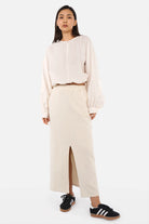 Alemene Sweatrock midi skirt in cold-washed cotton with elastic waistband and pink logo patch