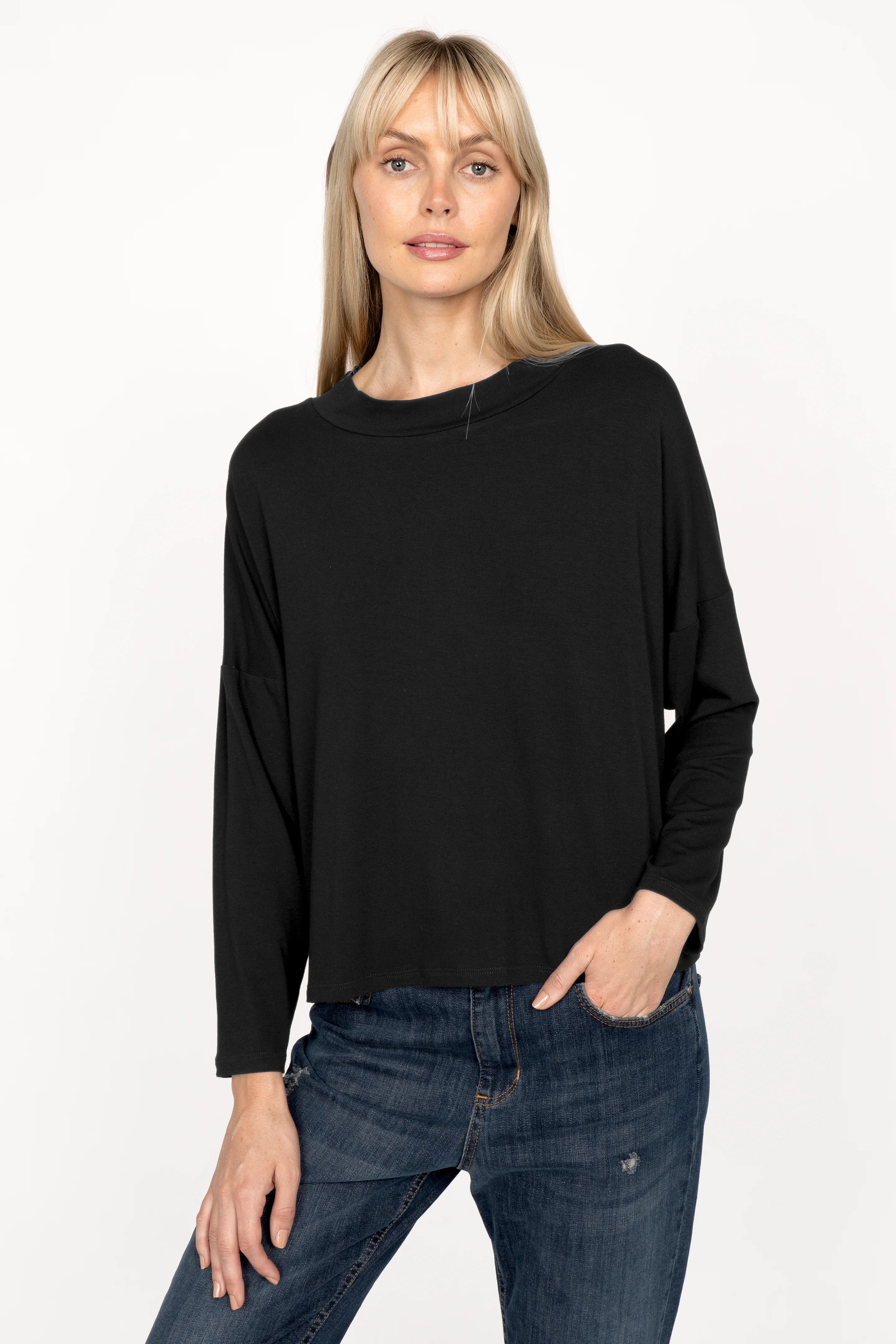 Woman wearing black lightweight viscose jersey longsleeve with loose neckline and dropped shoulders