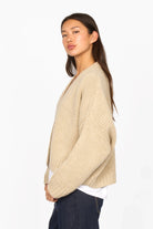 ALIXA Cropped Strickcardigan beige knit sweater with shawl collar and loose fit on model