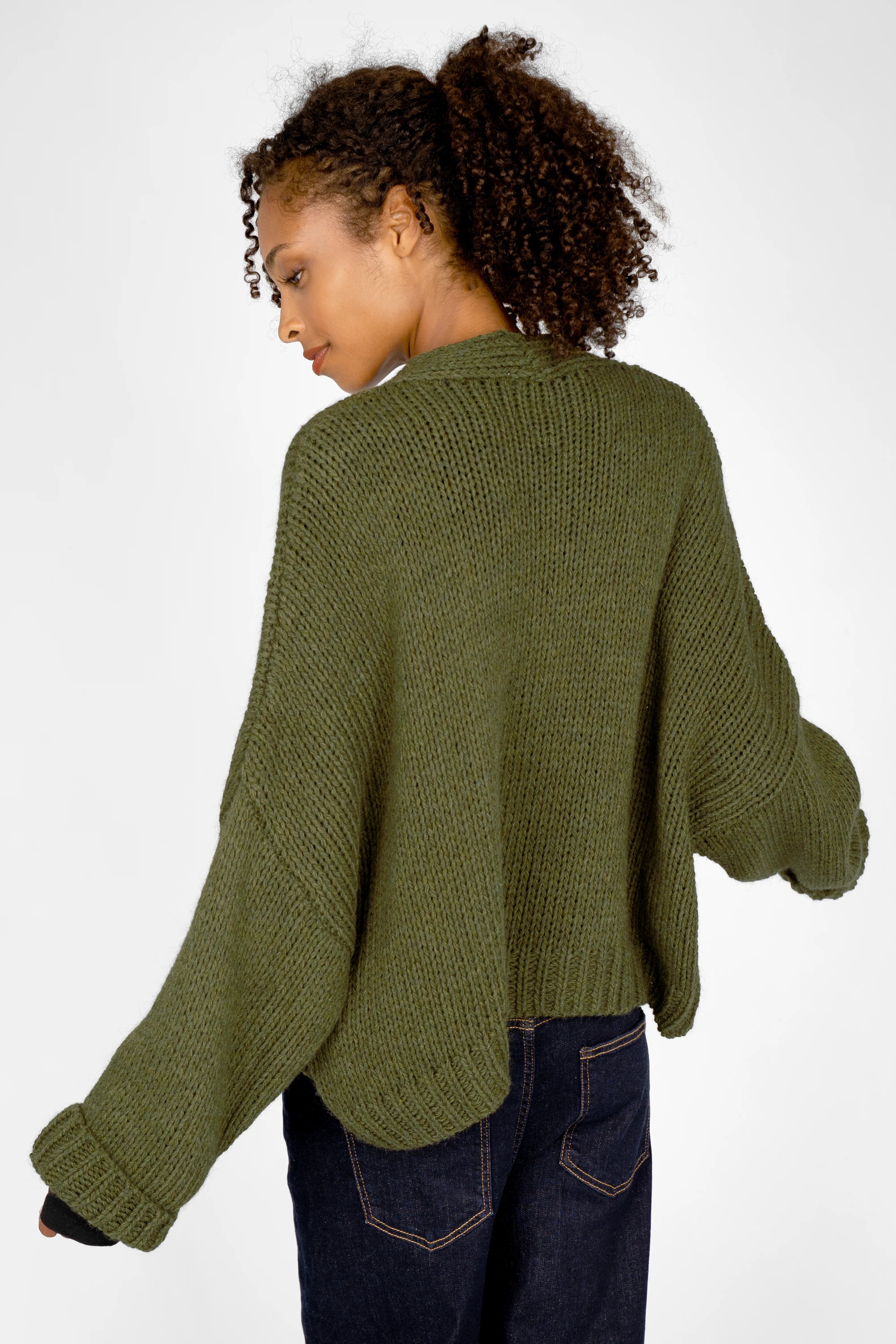 ALIXA Cropped Strickcardigan in olive green with loose fit and ribbed cuffs worn by model from back view