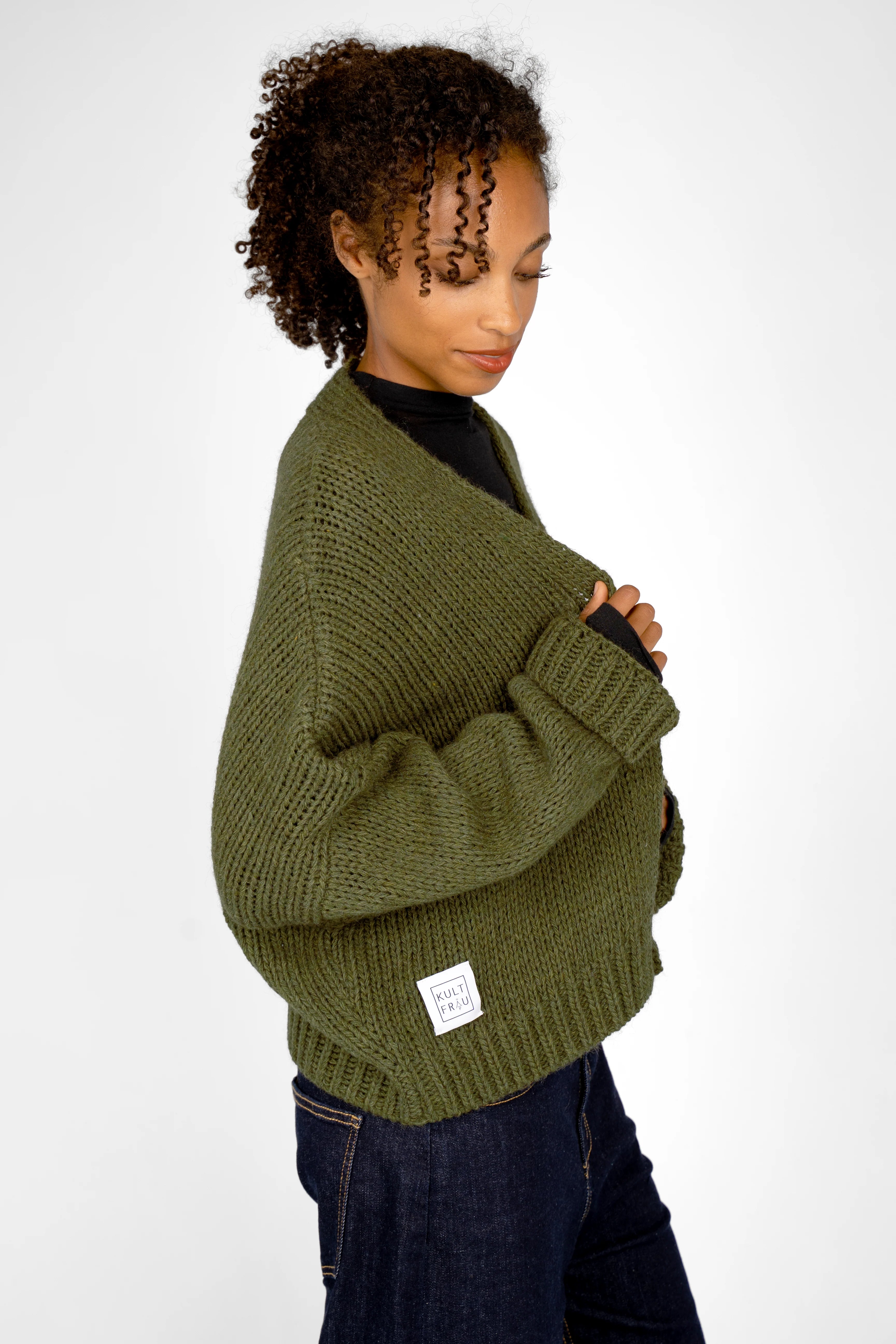 ALIXA cropped green knit cardigan with shawl collar and loose fit on model